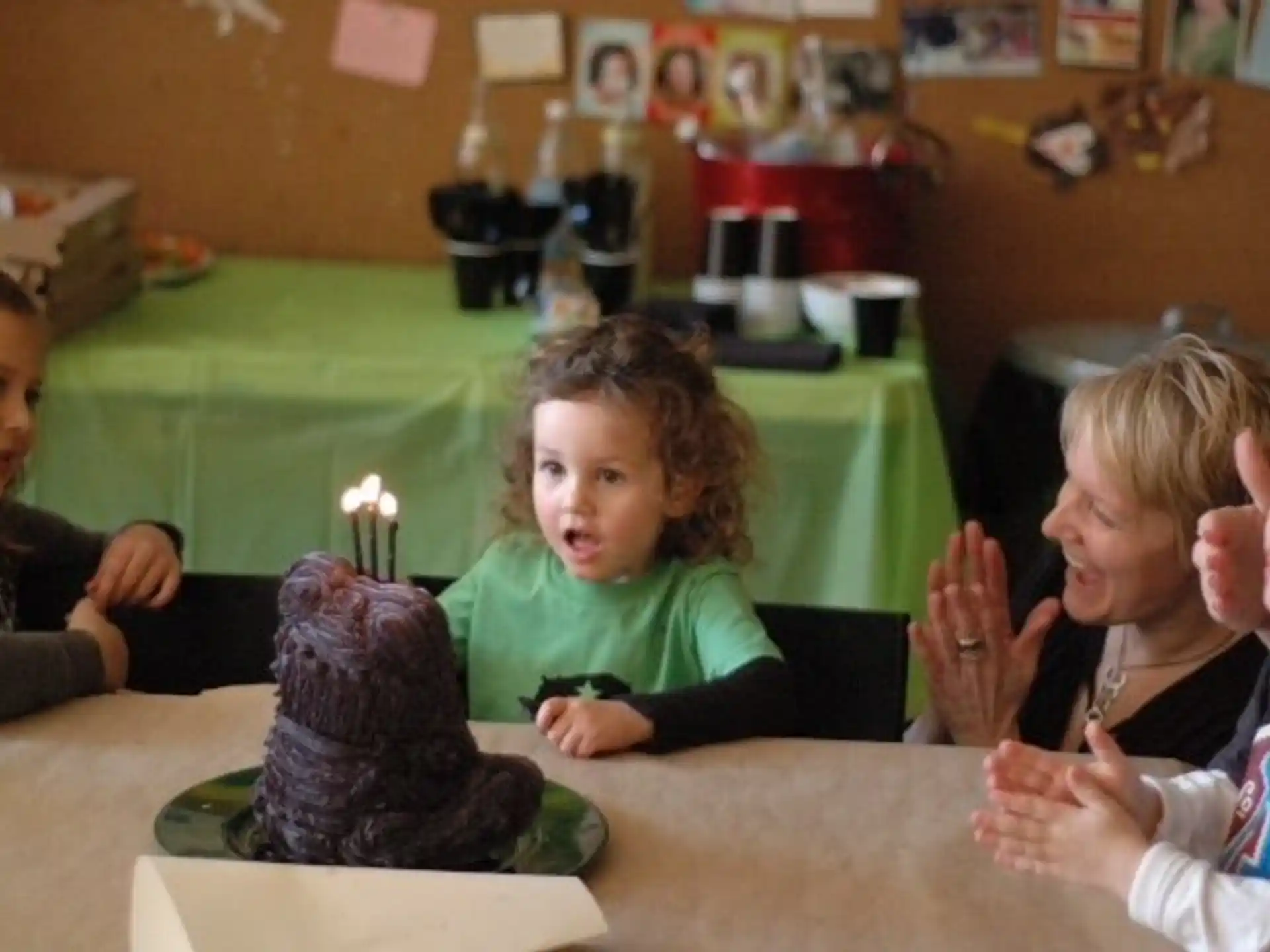 a group of children sitting at a table