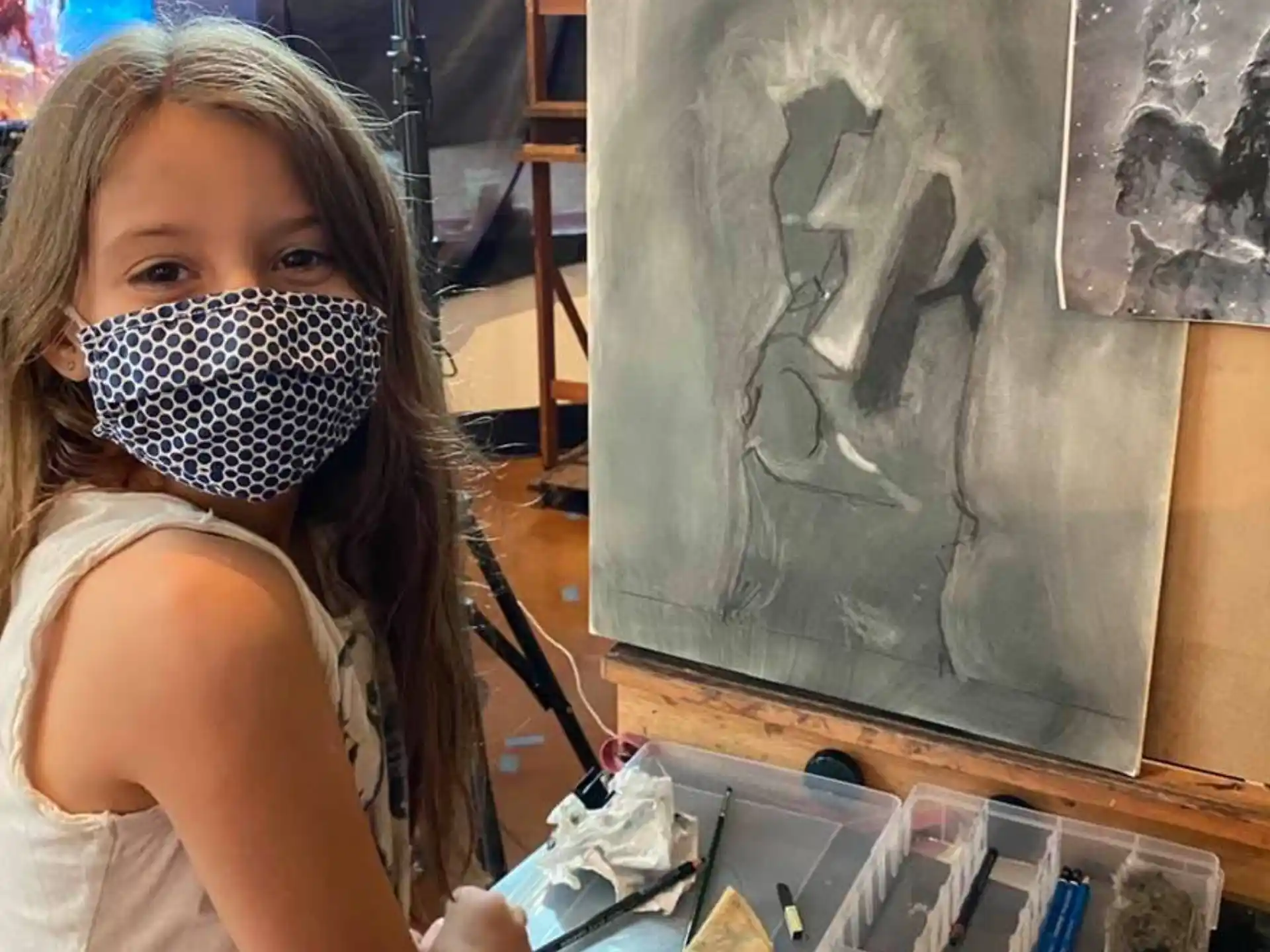 a girl painting a picture