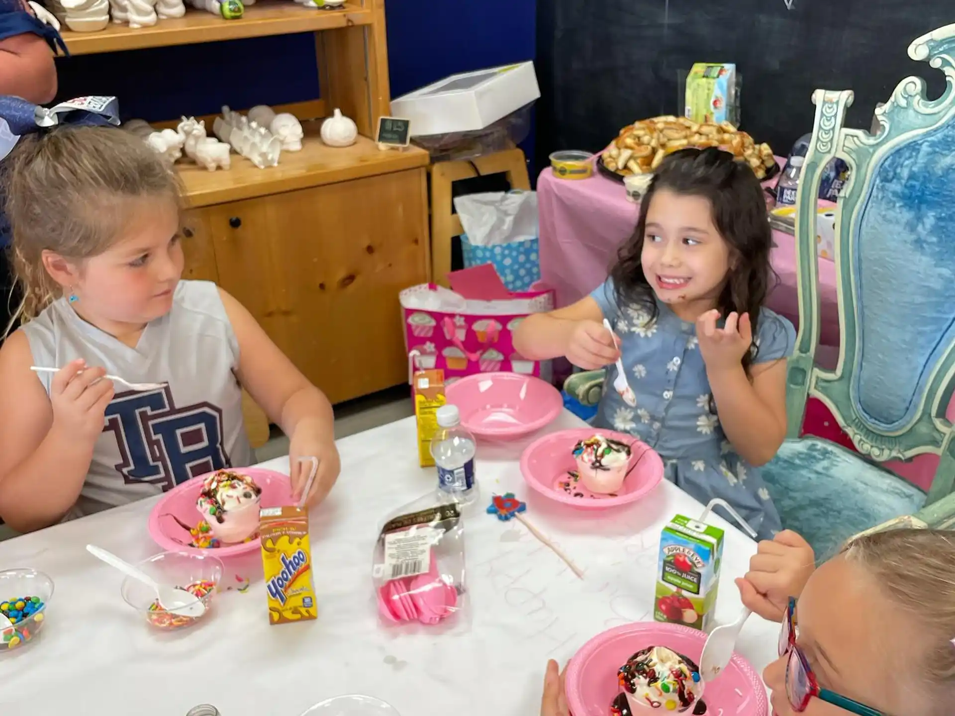 a group of children eating cake