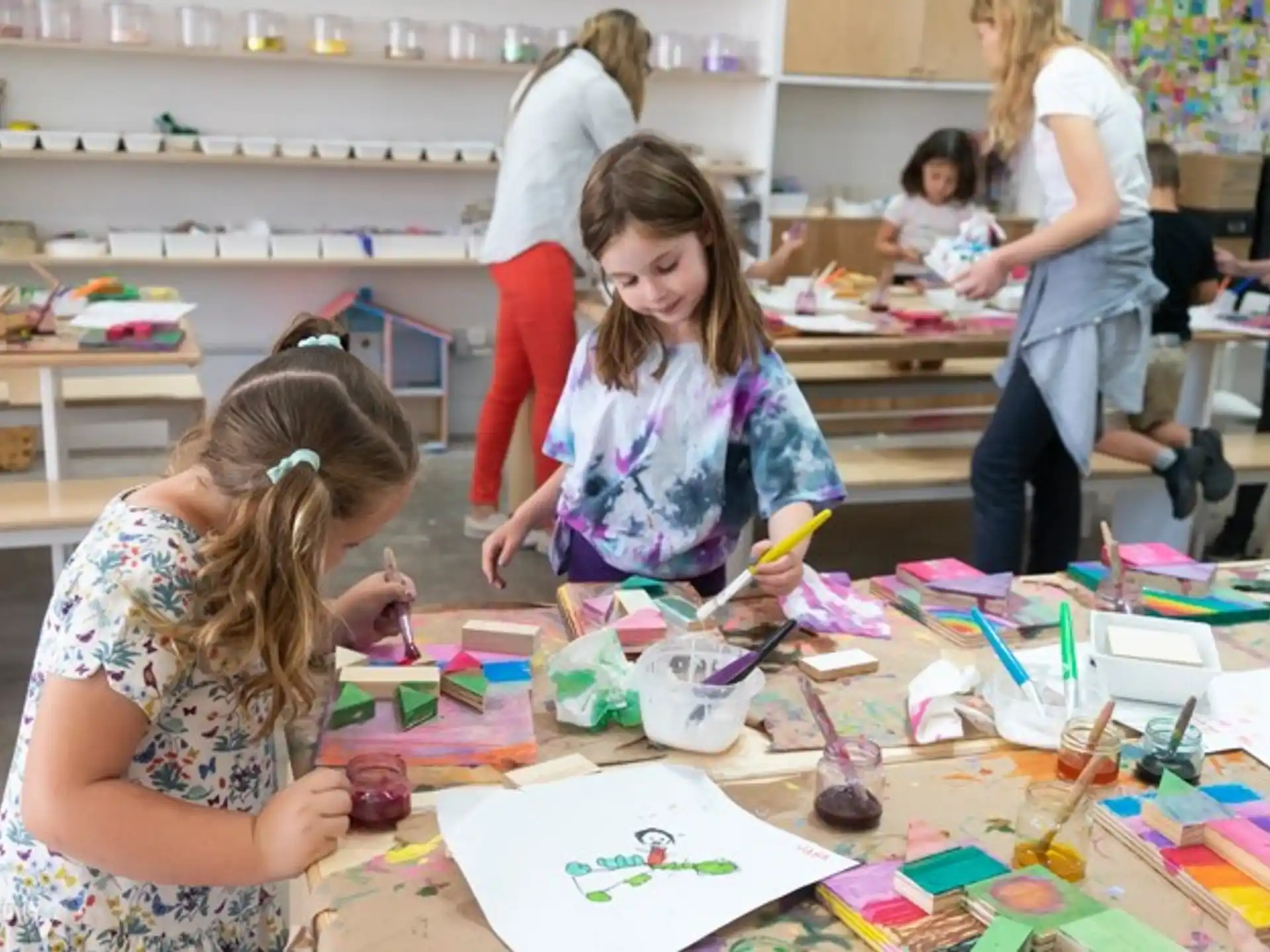a group of children painting