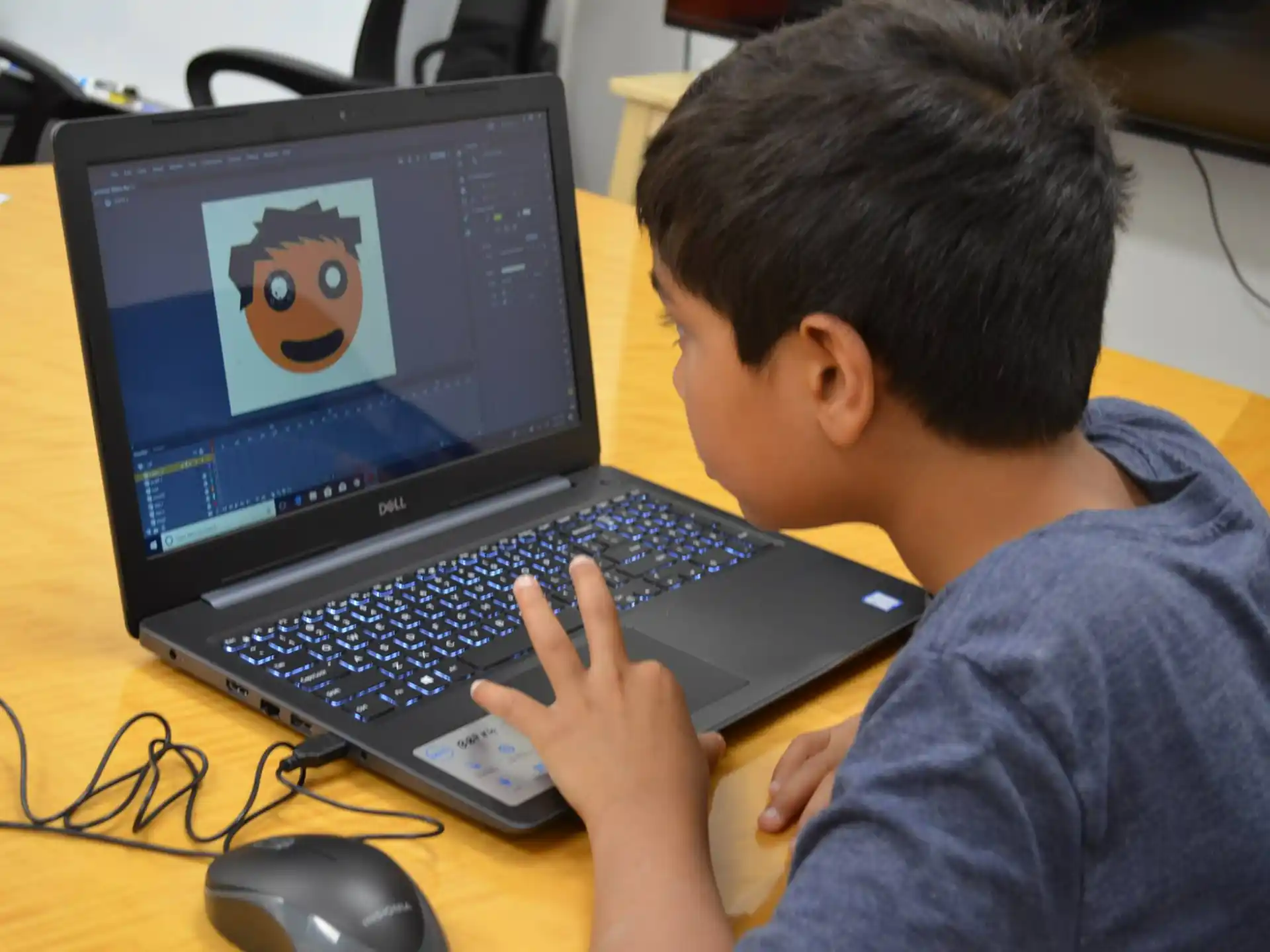 a boy using a laptop