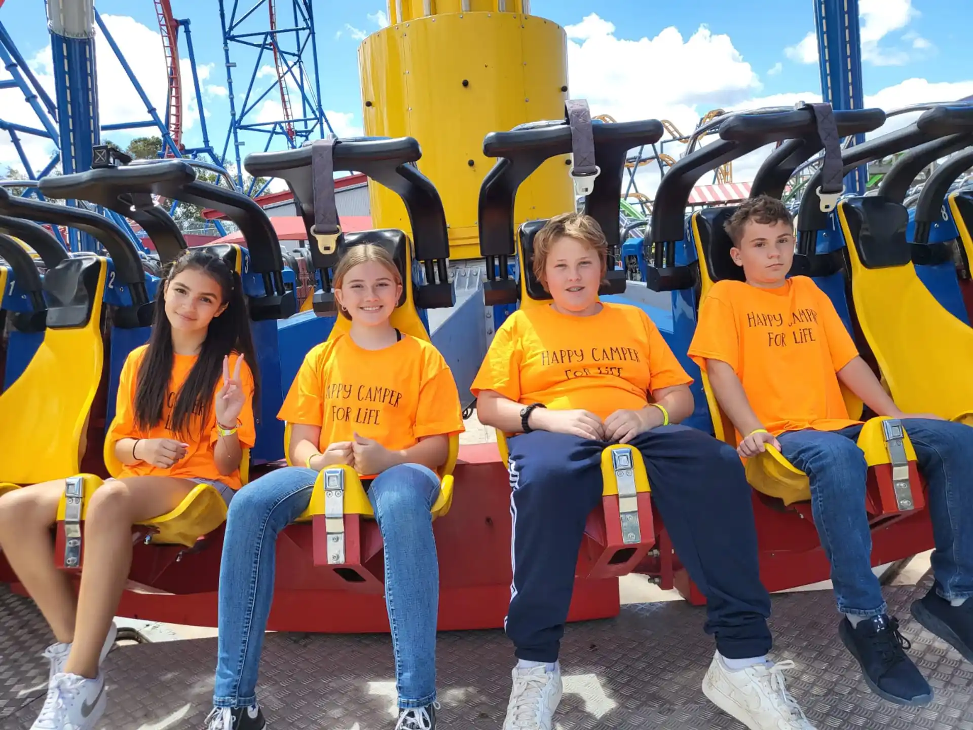a group of people sitting on a roller coaster