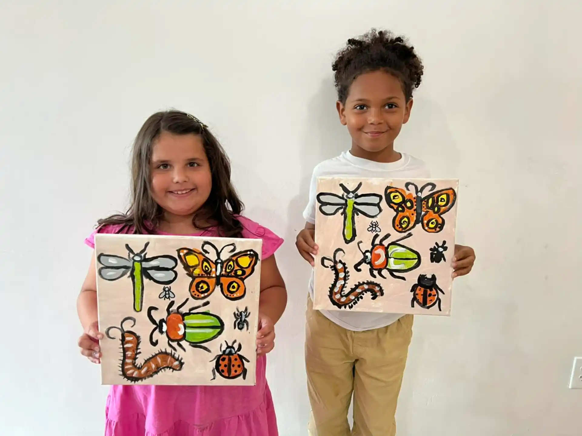 a couple of children holding up signs