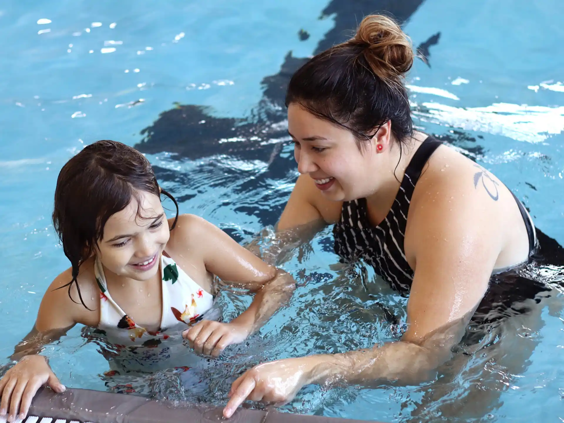 a person and a girl in the water