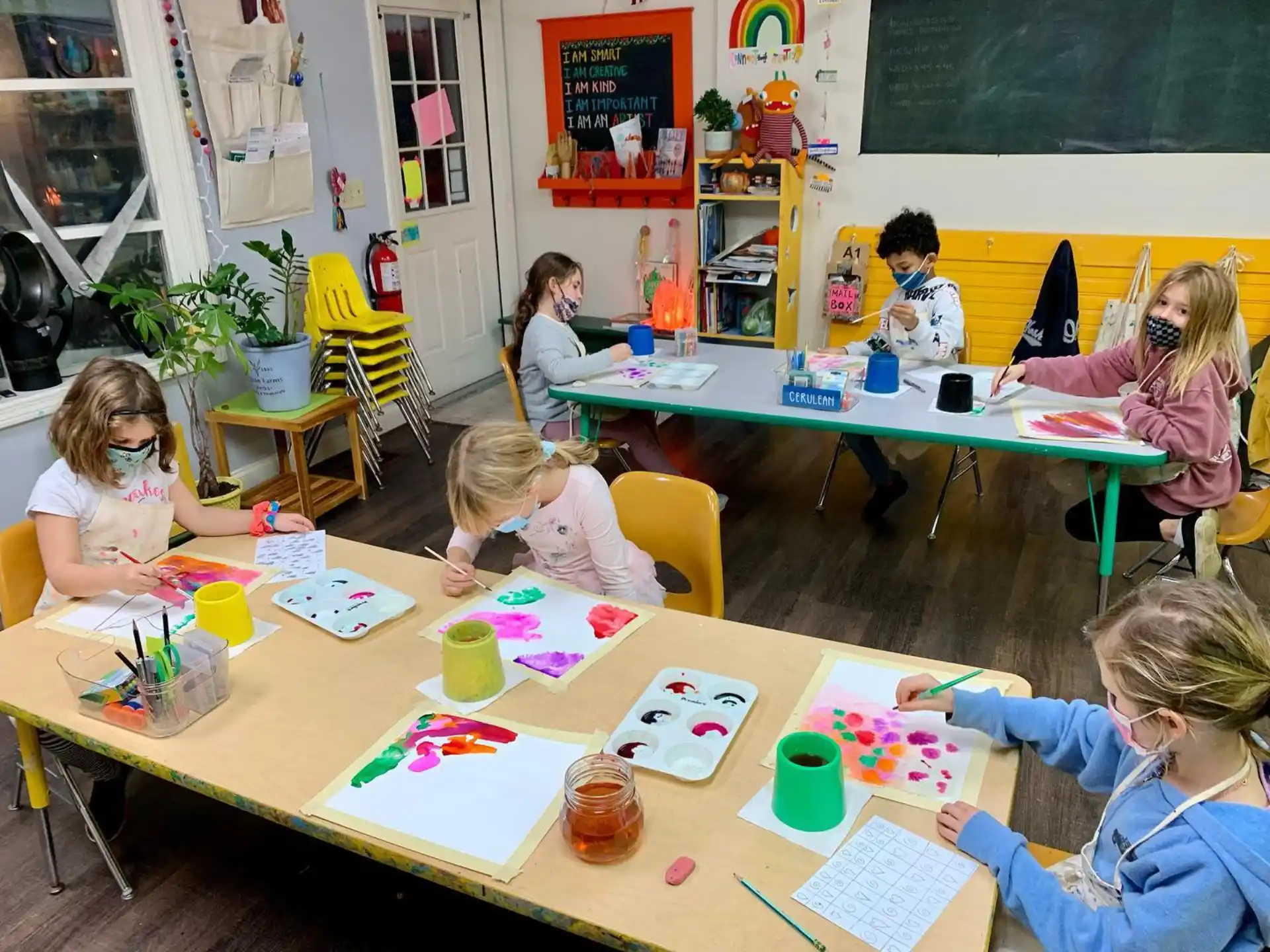a group of children sitting at a table