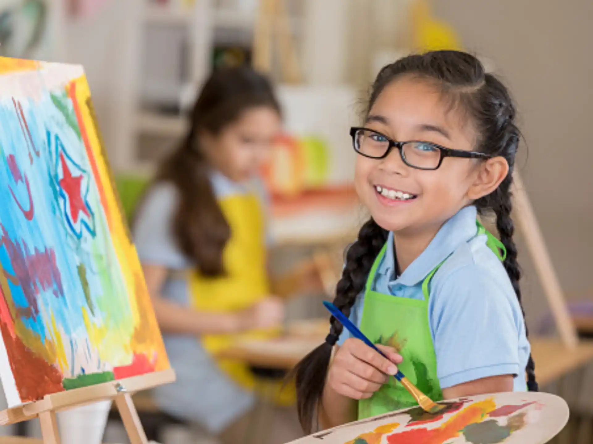 a young girl painting