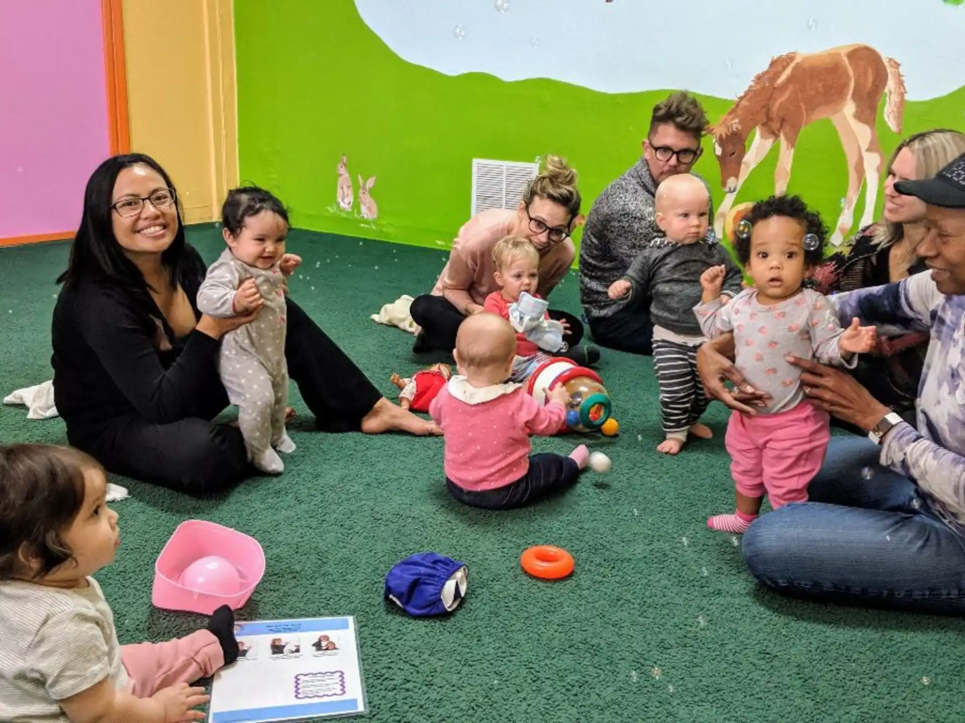 a group of people sitting on the floor