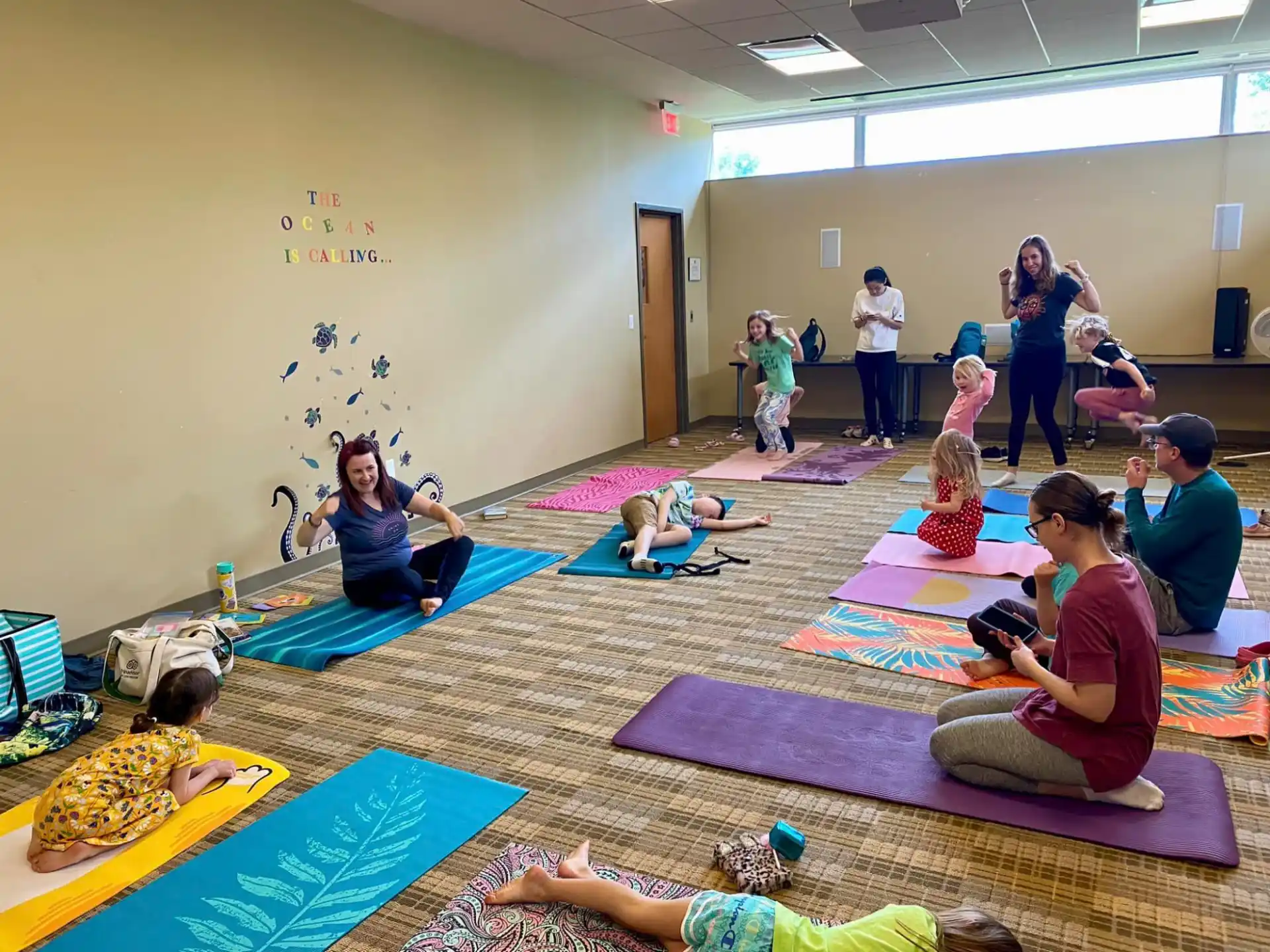 a group of people exercising in a room