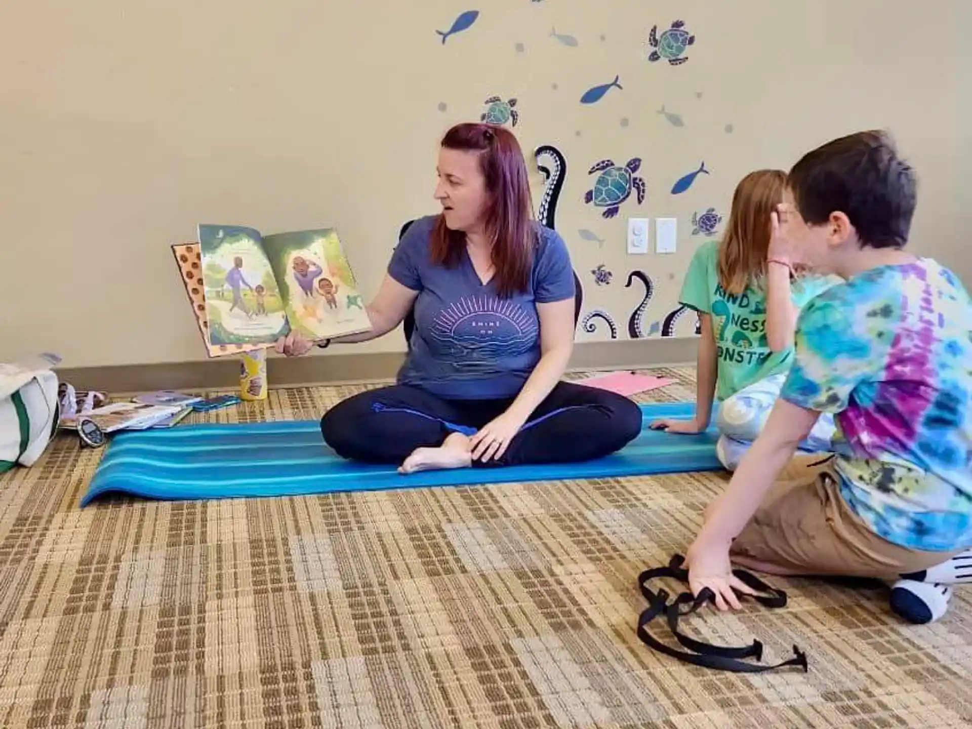a group of people sitting on a bed