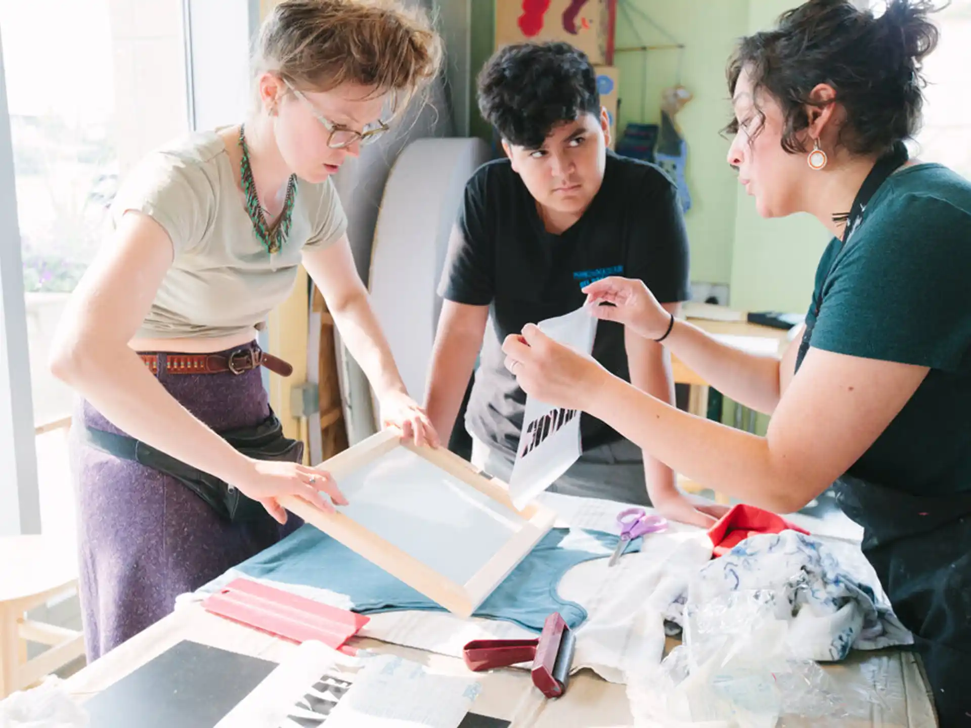 a group of women looking at a piece of paper