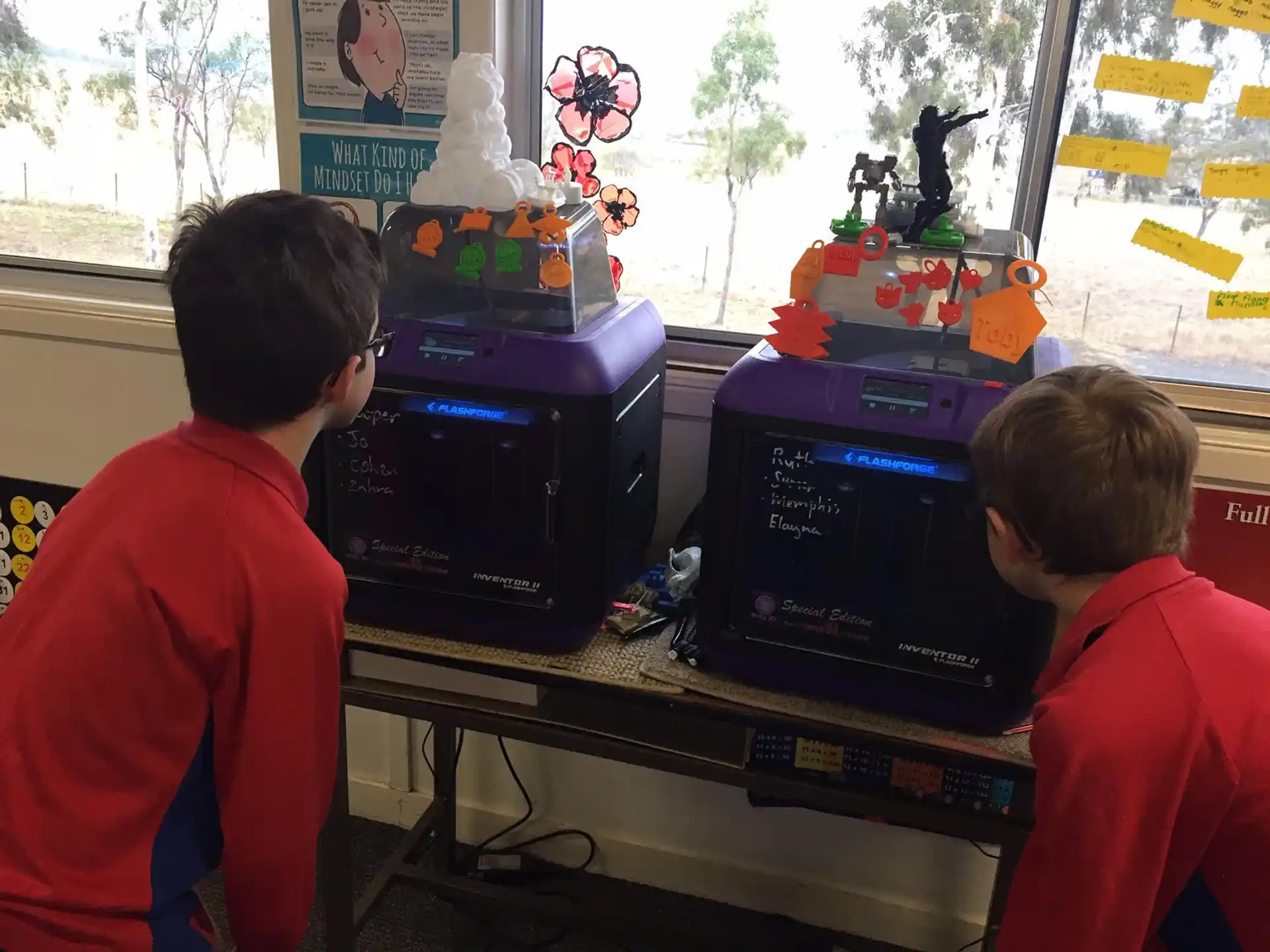 a couple of boys playing a video game