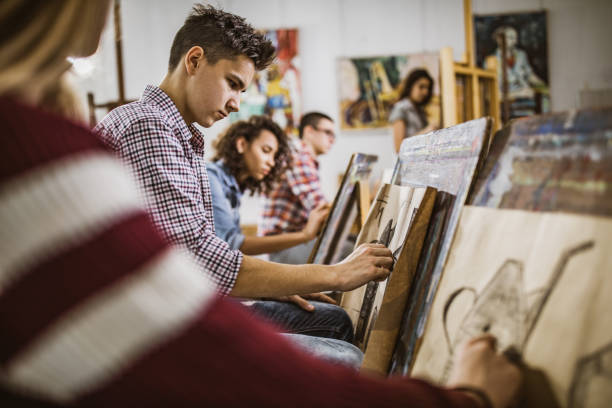 a person drawing on a piece of paper