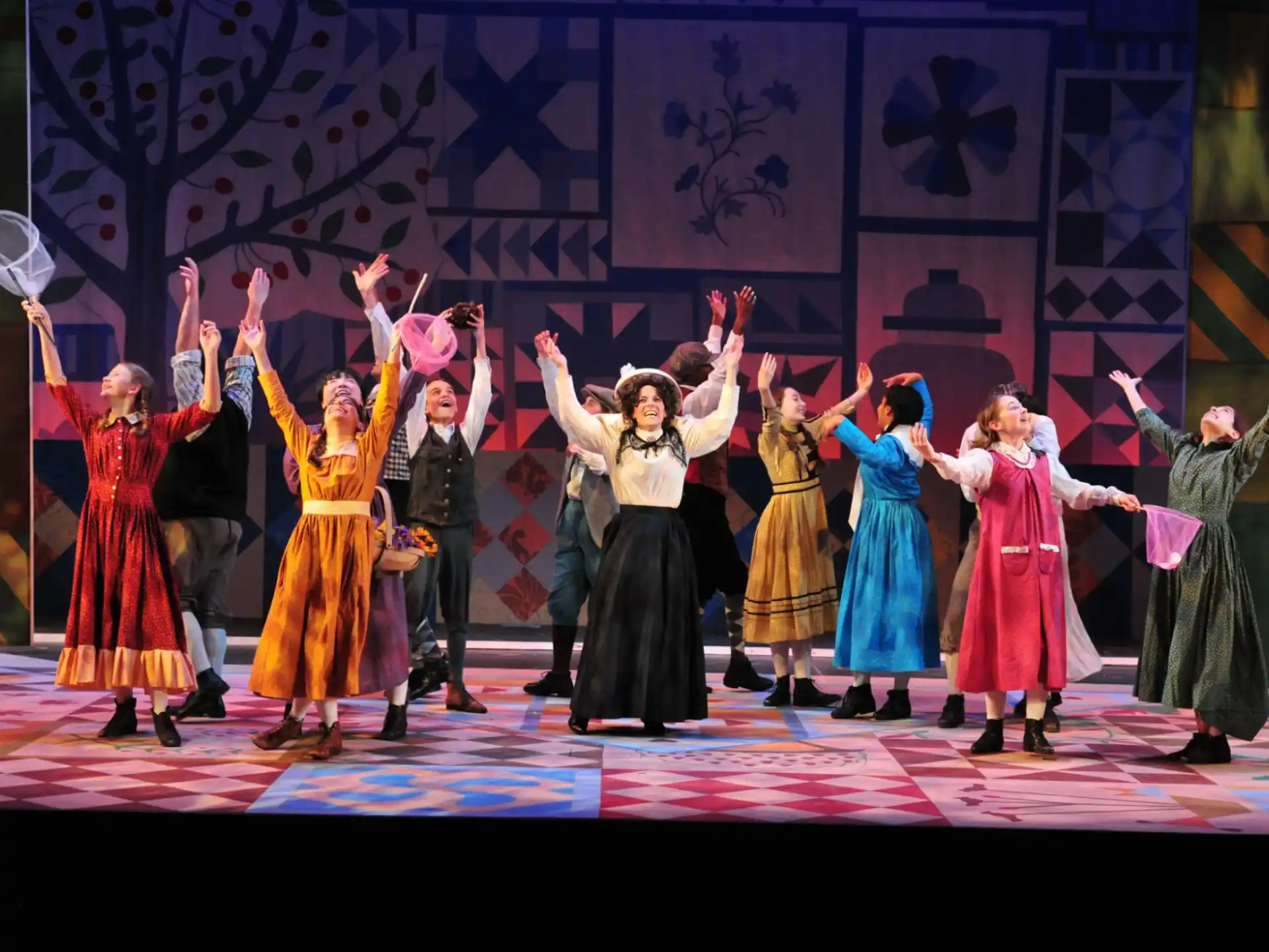 a group of people in clothing on a stage