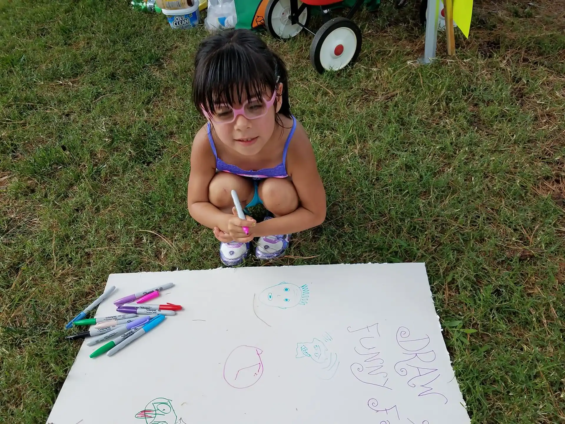 a child sitting on the grass