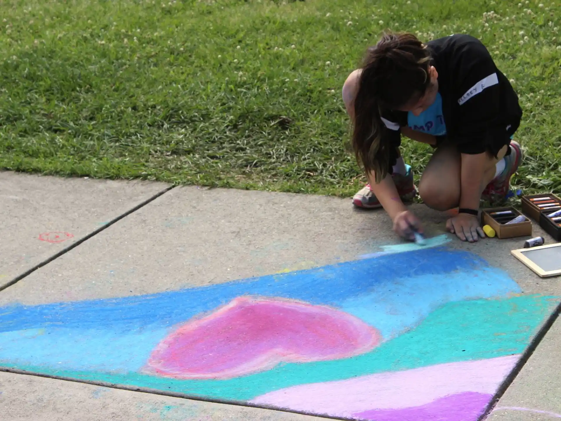 a person painting on the ground