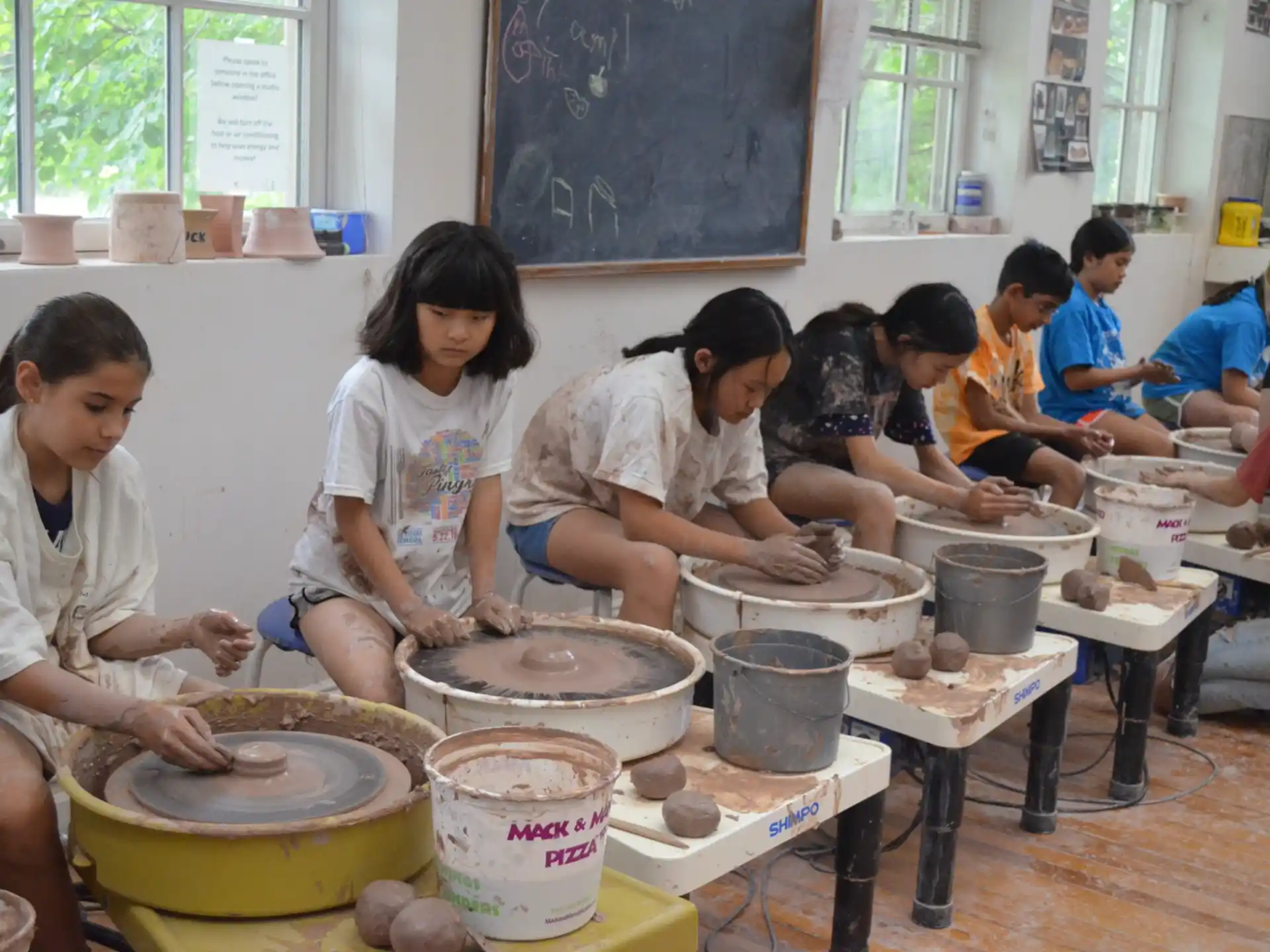 a group of children playing drums