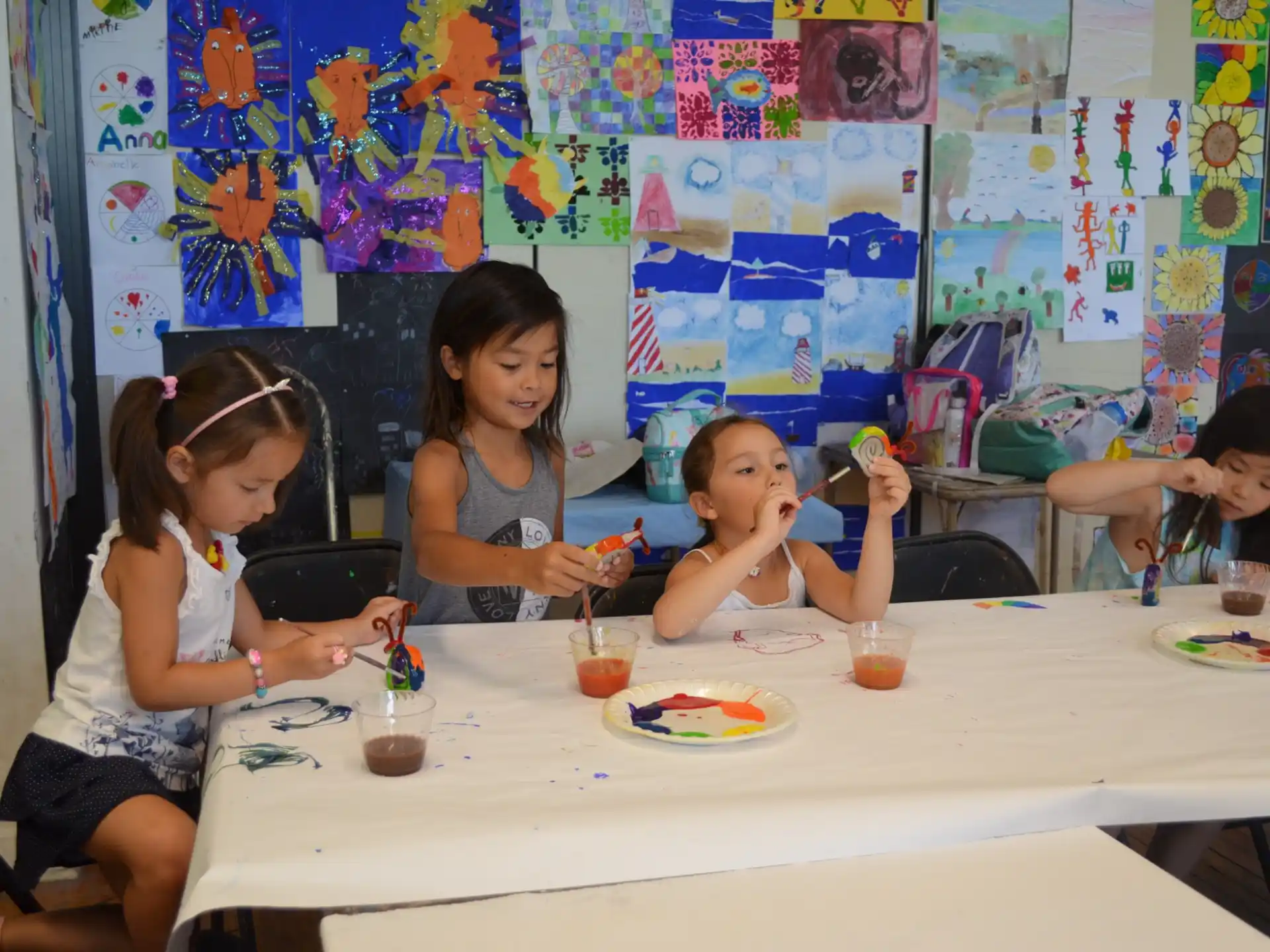 a group of girls eating at a table