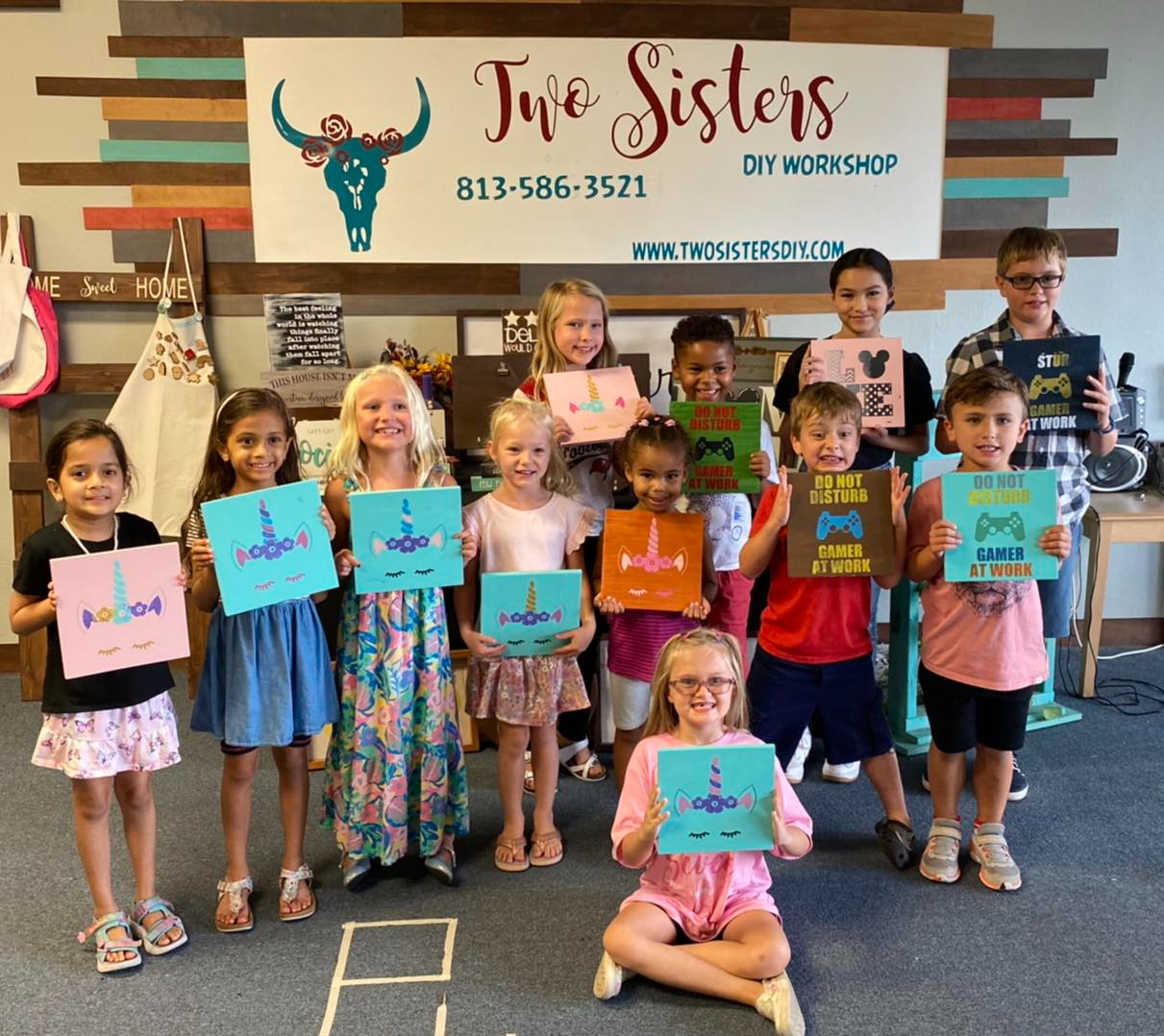 a group of children holding signs