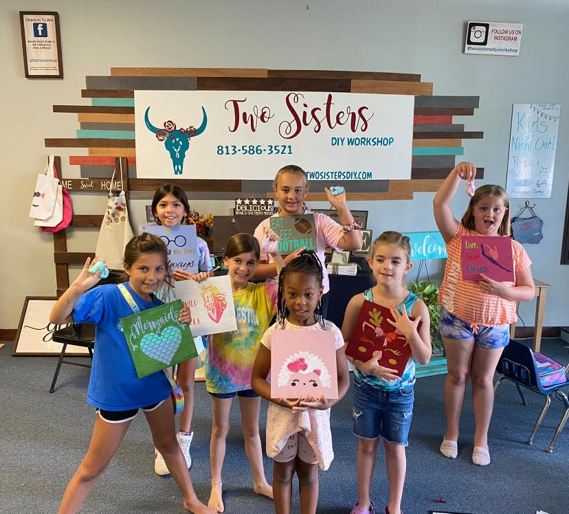 a group of children holding up signs