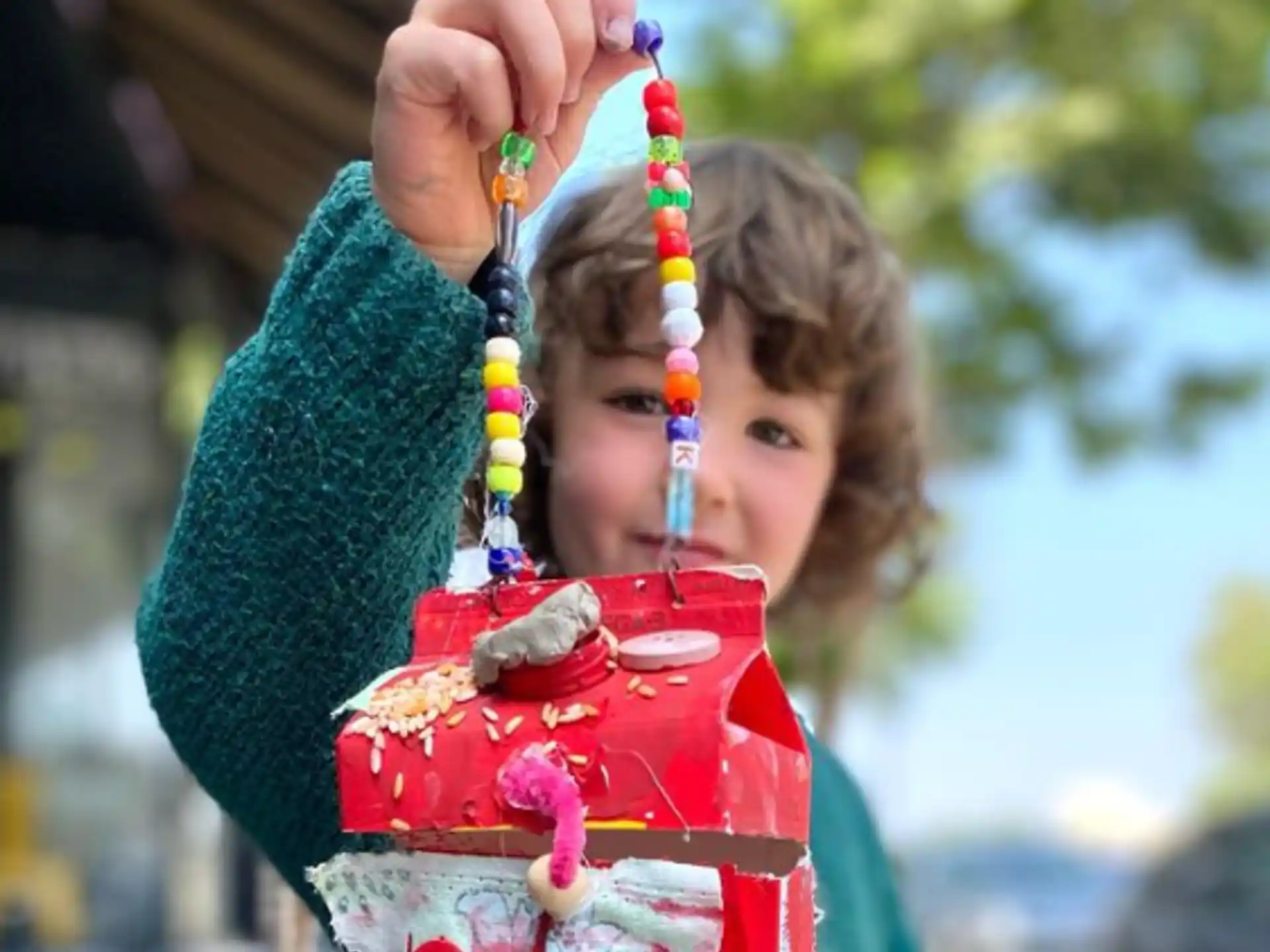 a girl holding a toy