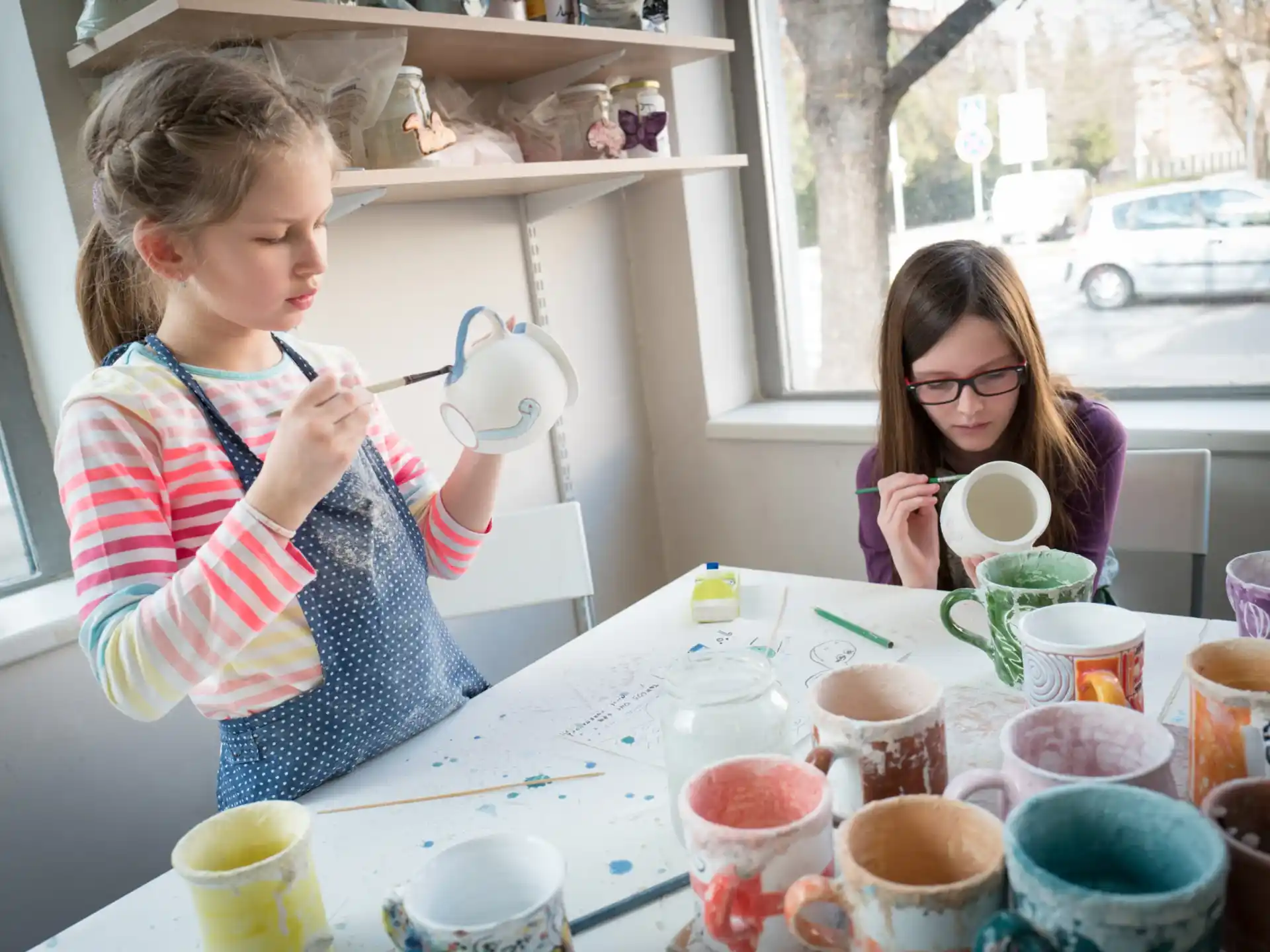 a couple of girls painting