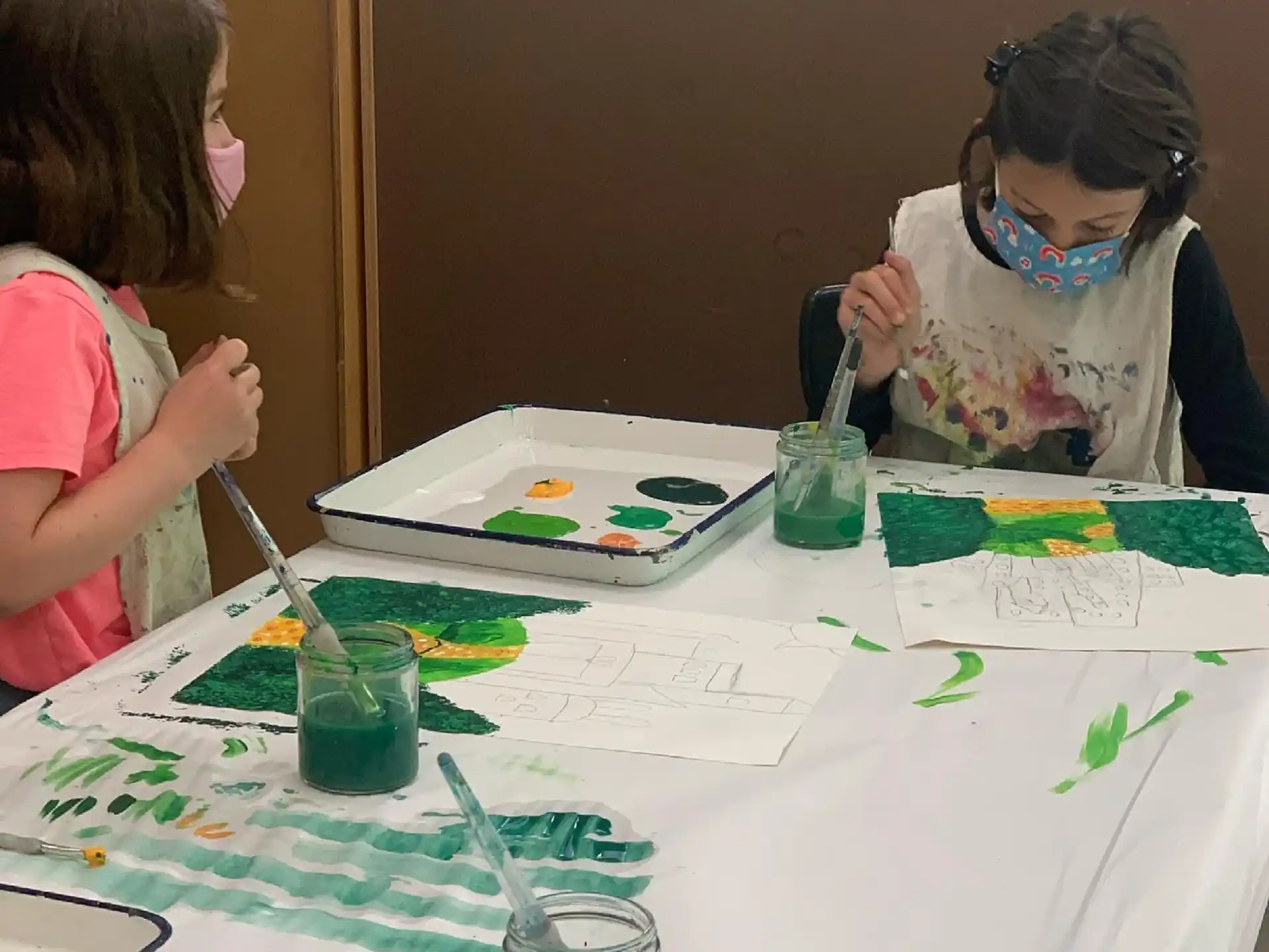 a few young girls painting