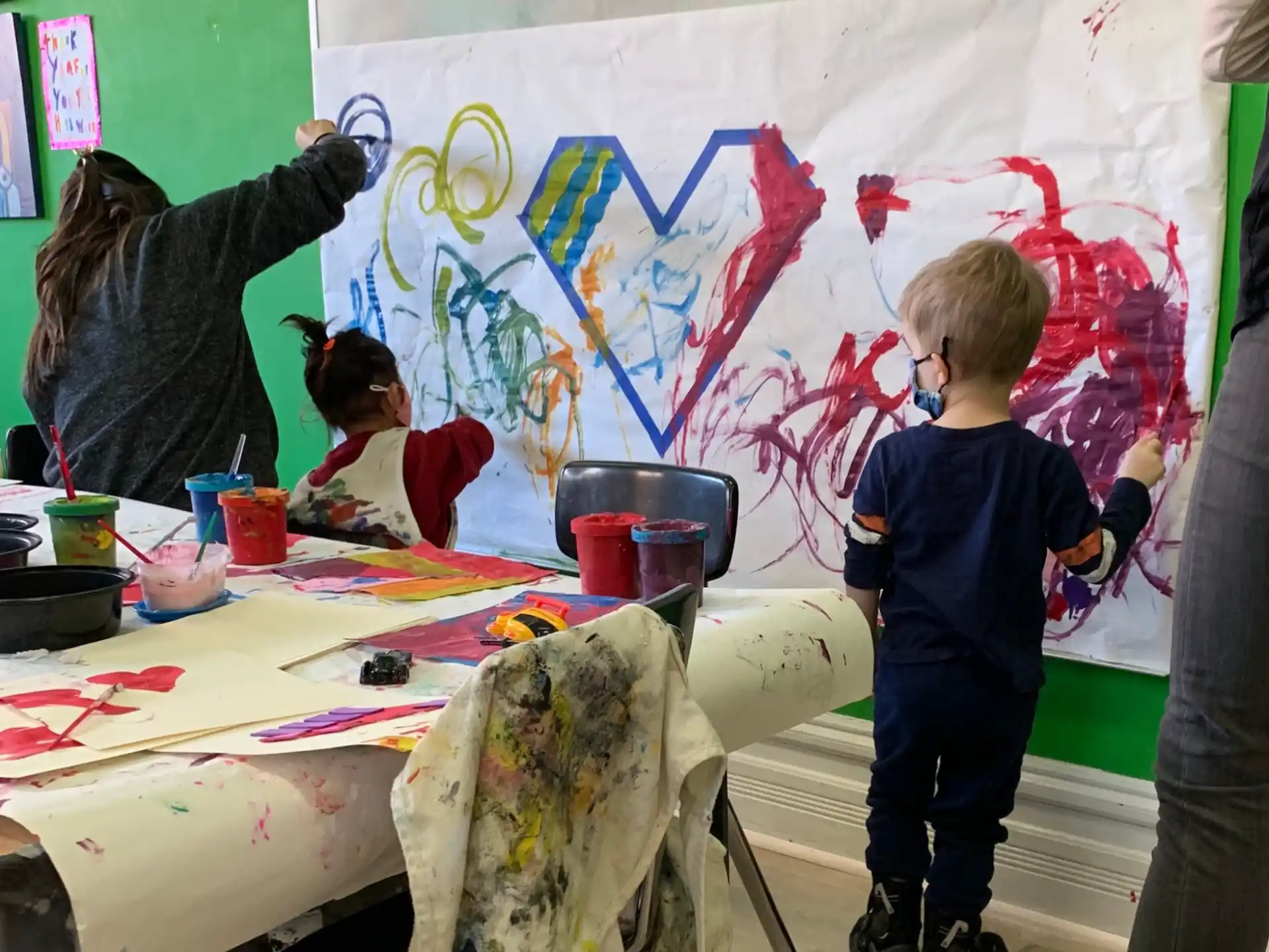 a group of children painting