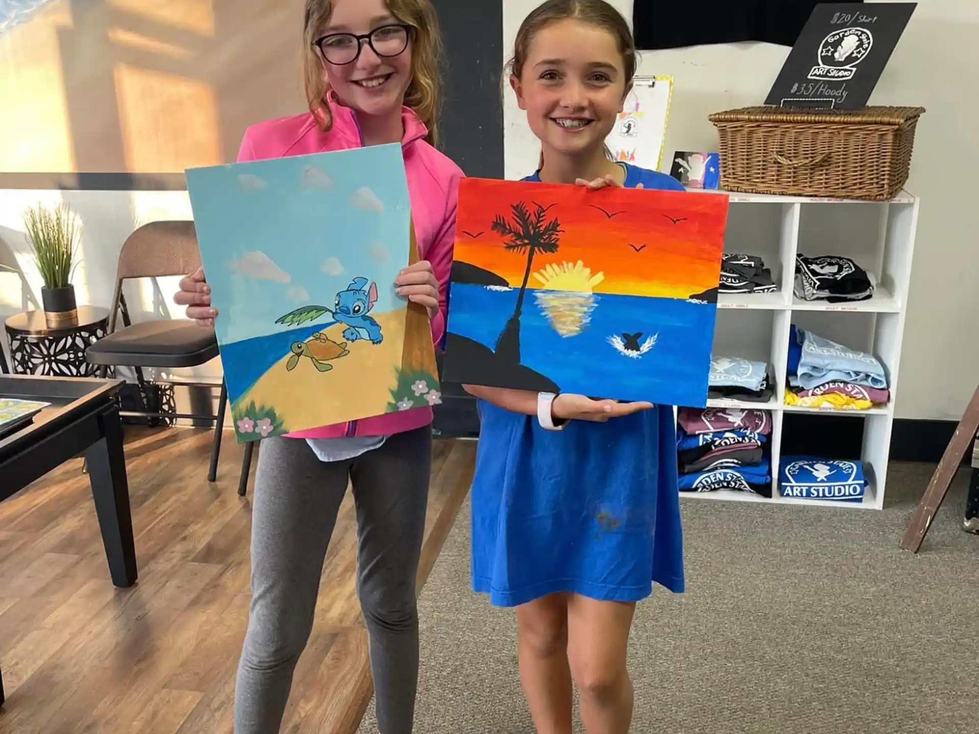 a couple of girls holding a book