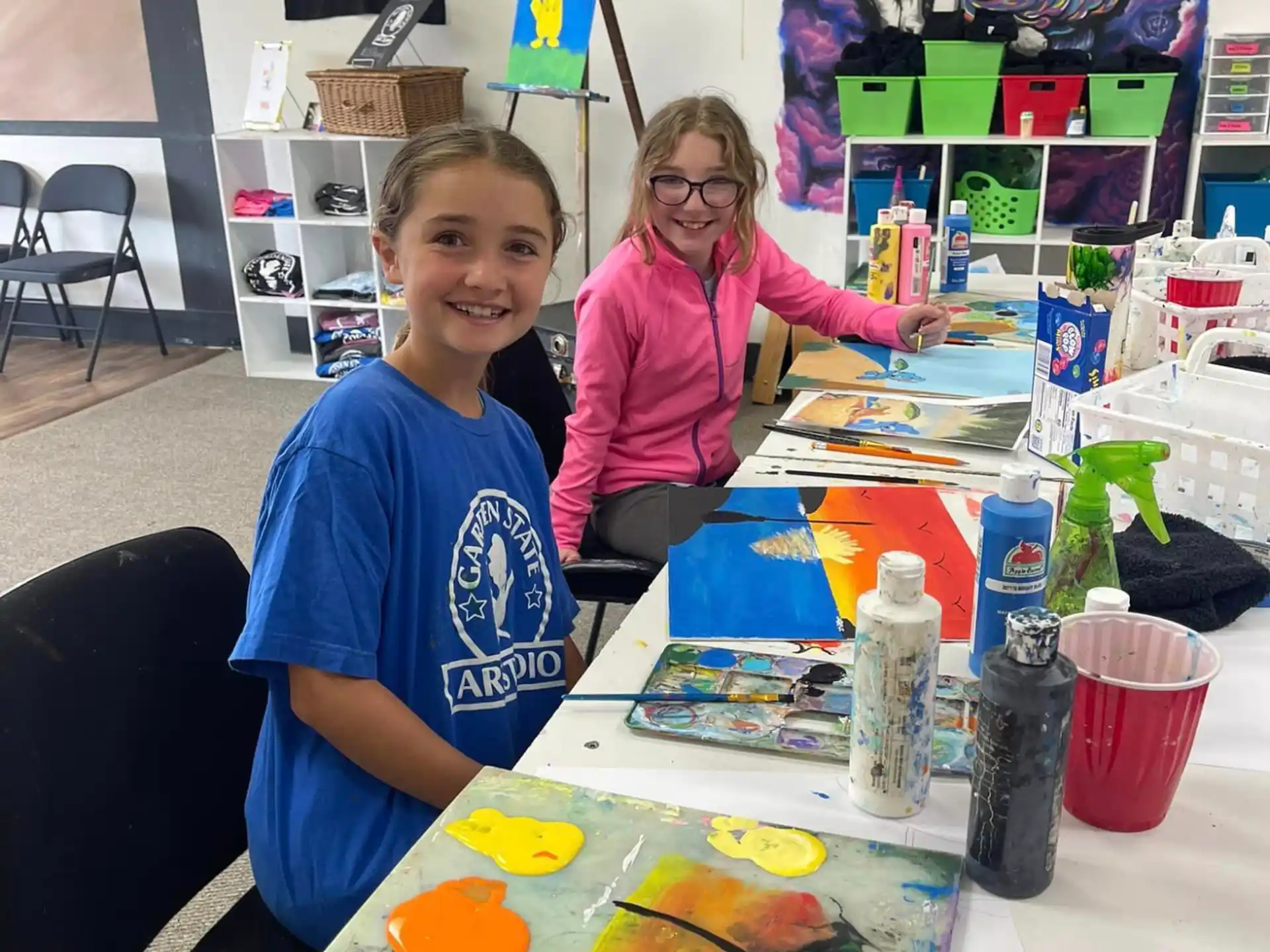 a person and a boy painting
