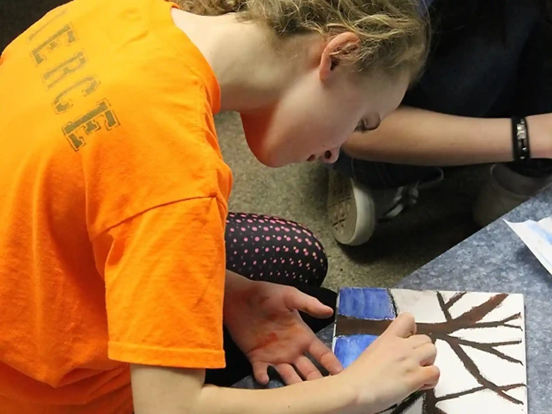 a young girl painting