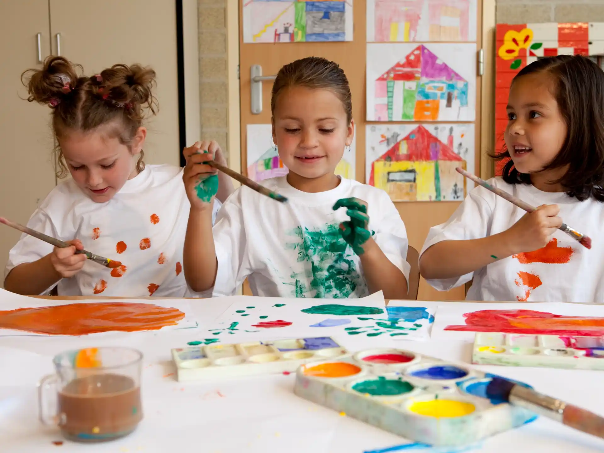 a group of children painting