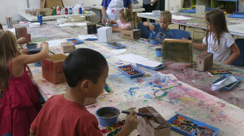 children painting on the floor