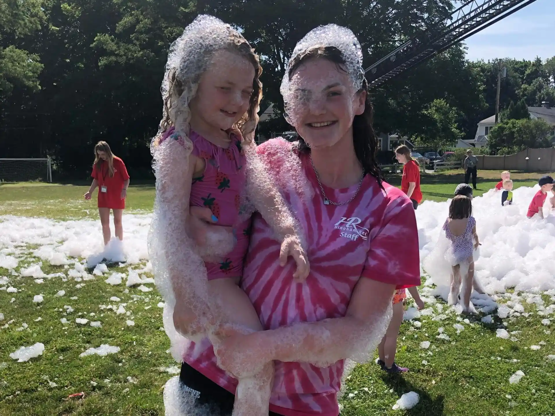 a person holding a child