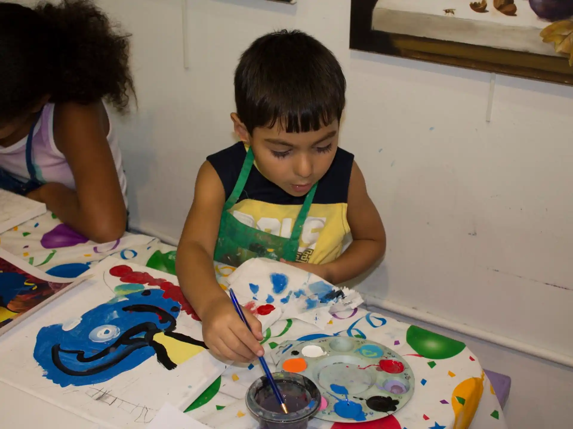 a young boy painting