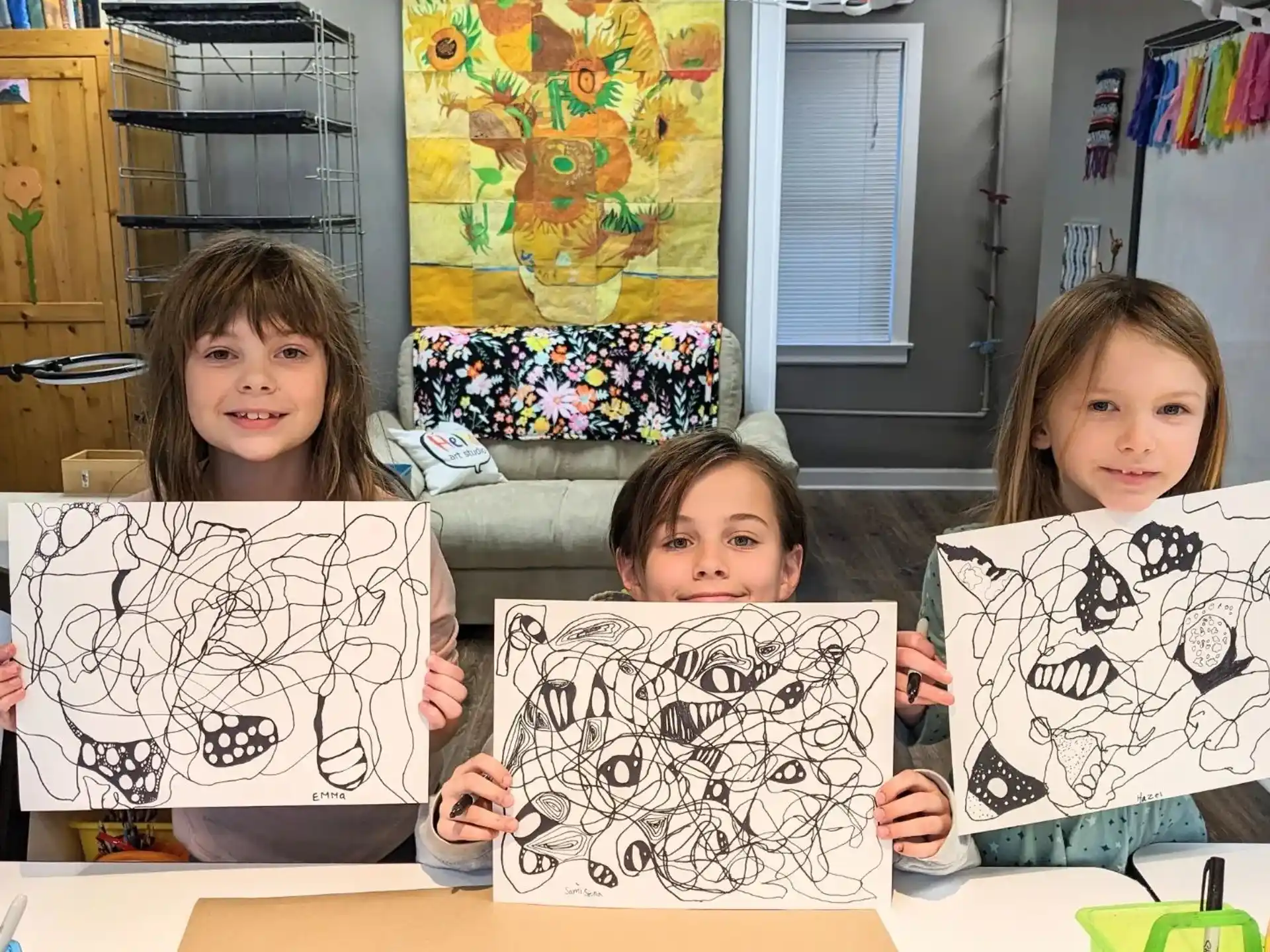 a group of children sitting at a table