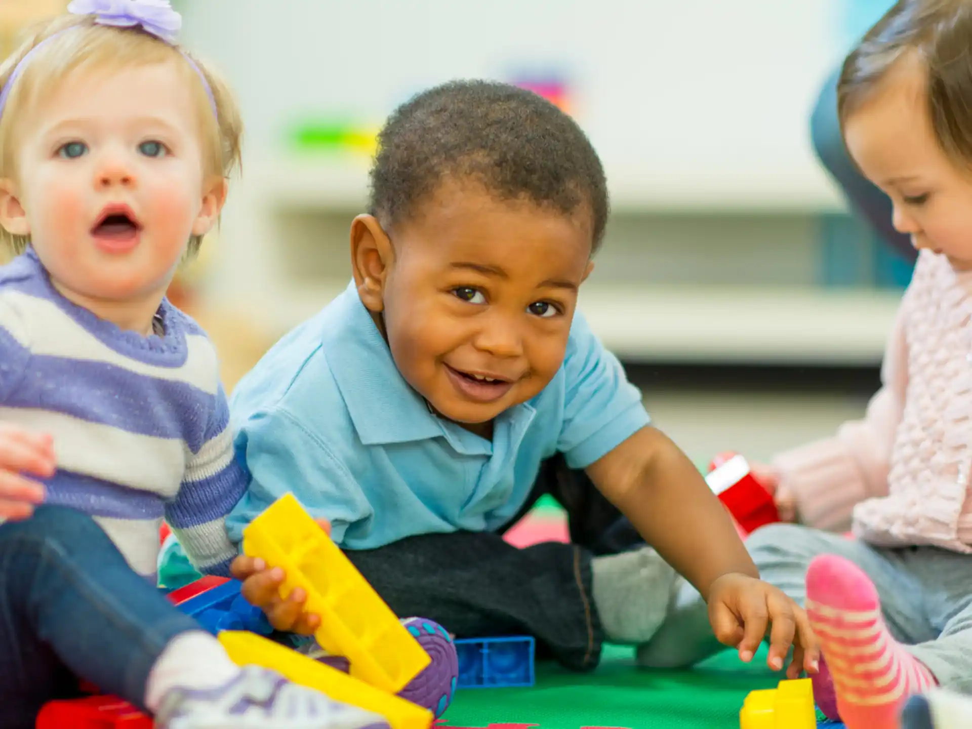 a group of children playing with toys