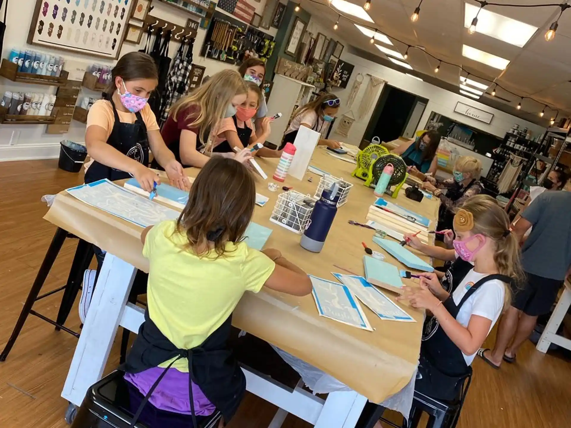 a group of children sitting at desks in a classroom