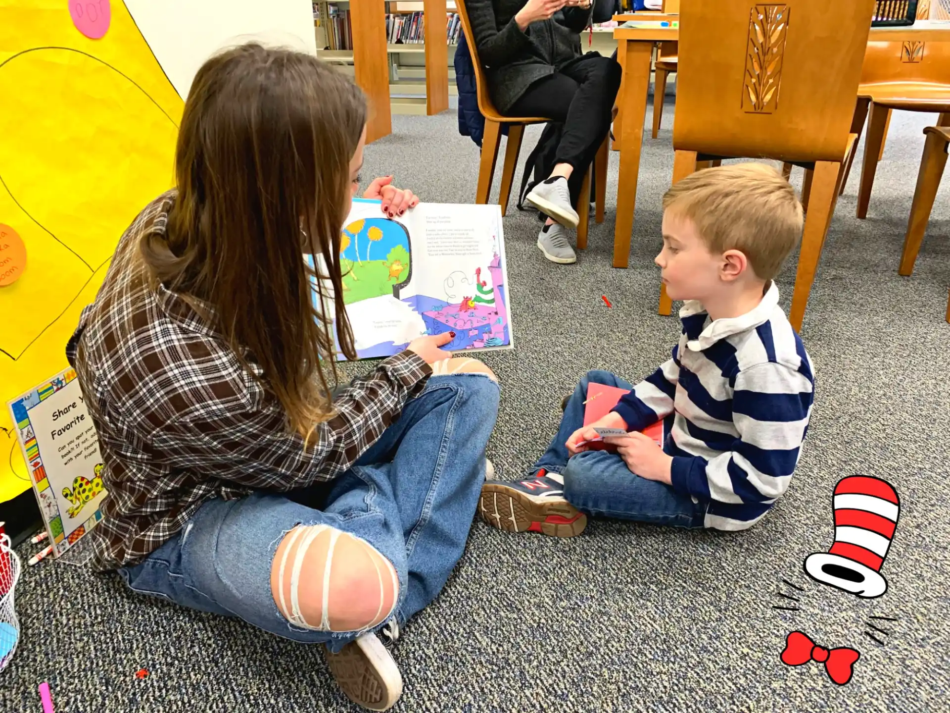 a person and a child reading books