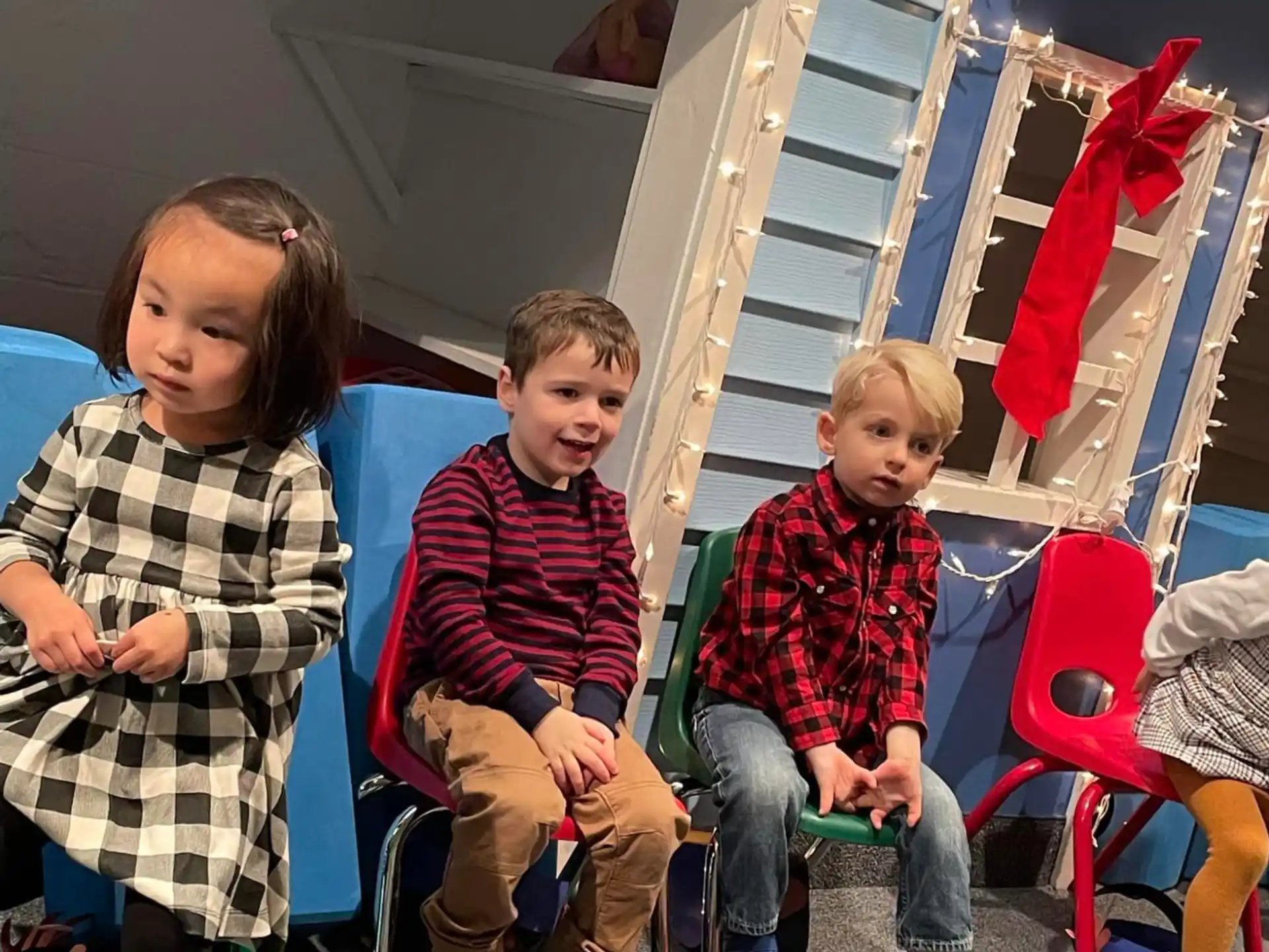 a group of children sitting on a bench