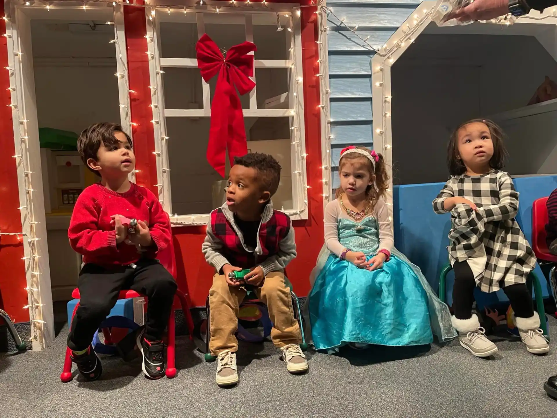 a group of children sitting on the floor