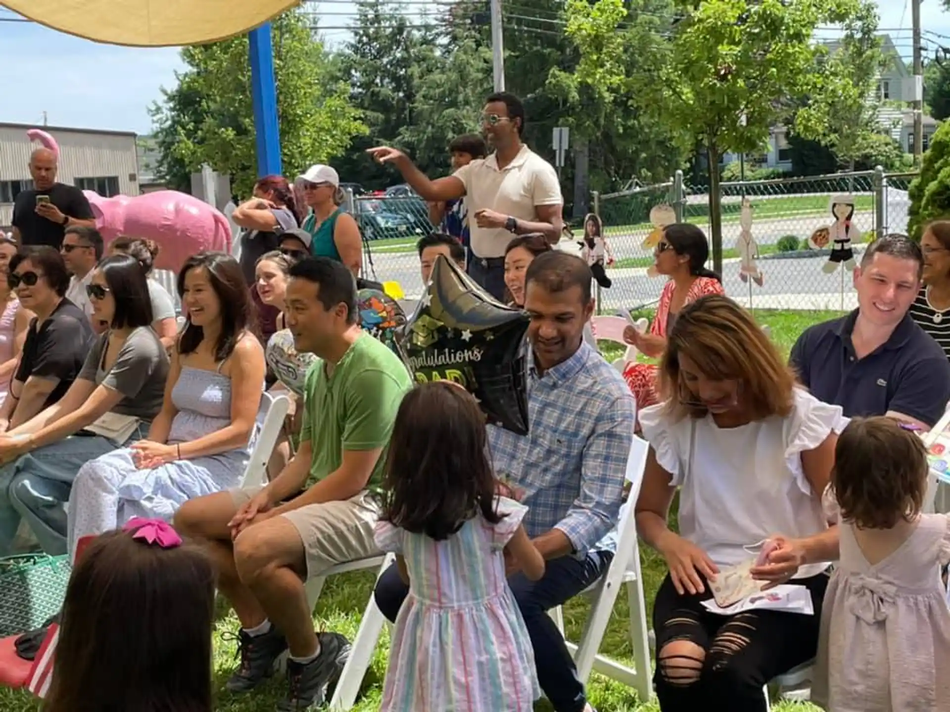 a group of people sitting on the ground