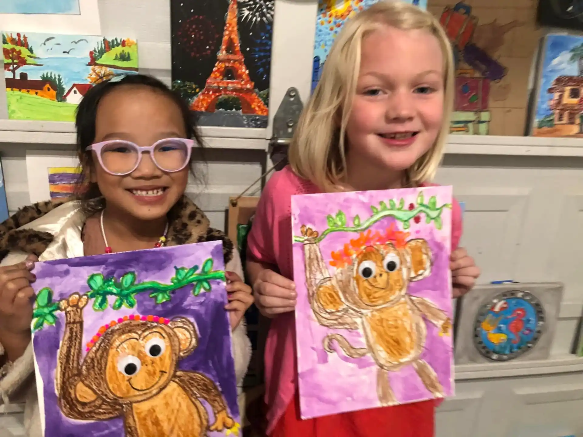 a couple of girls holding gift bags