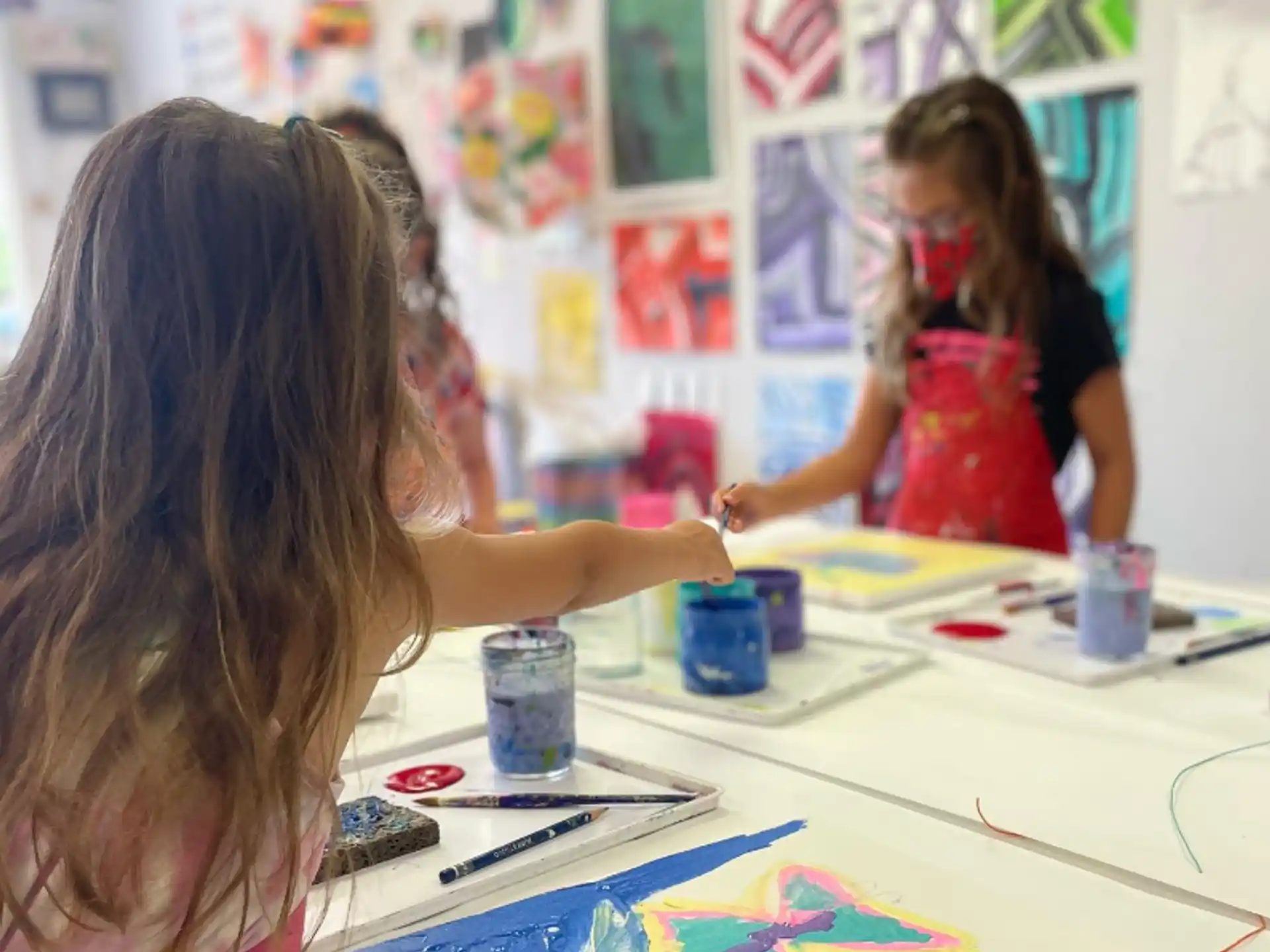 a girl painting on a table