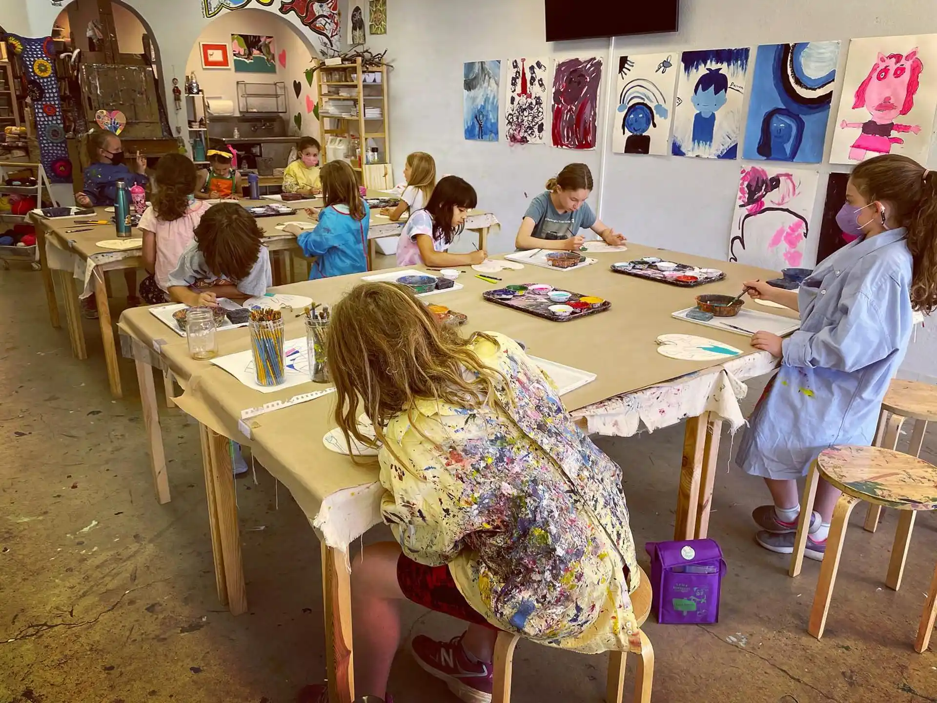 a group of children sitting at tables