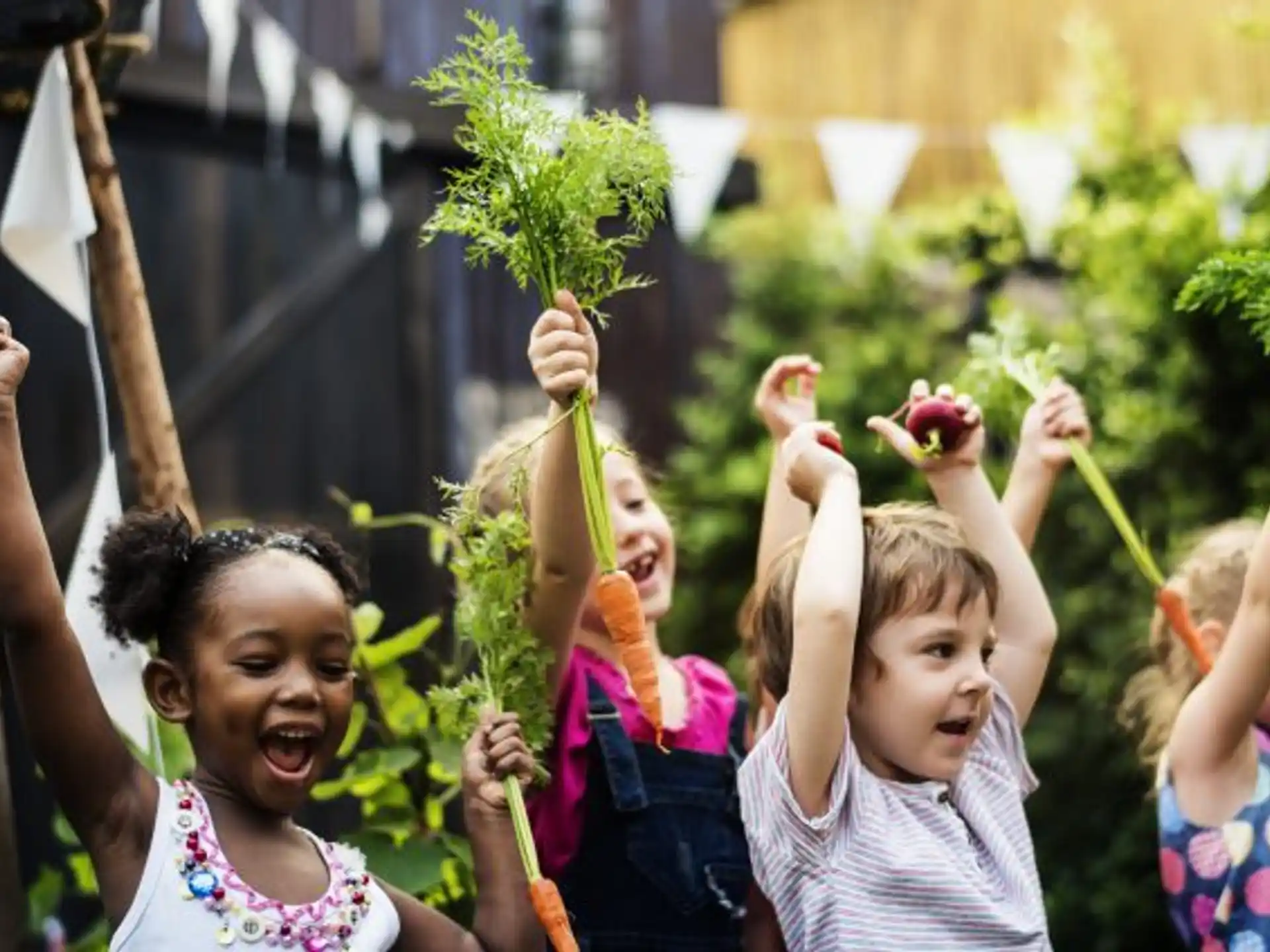 a group of children holding flowers