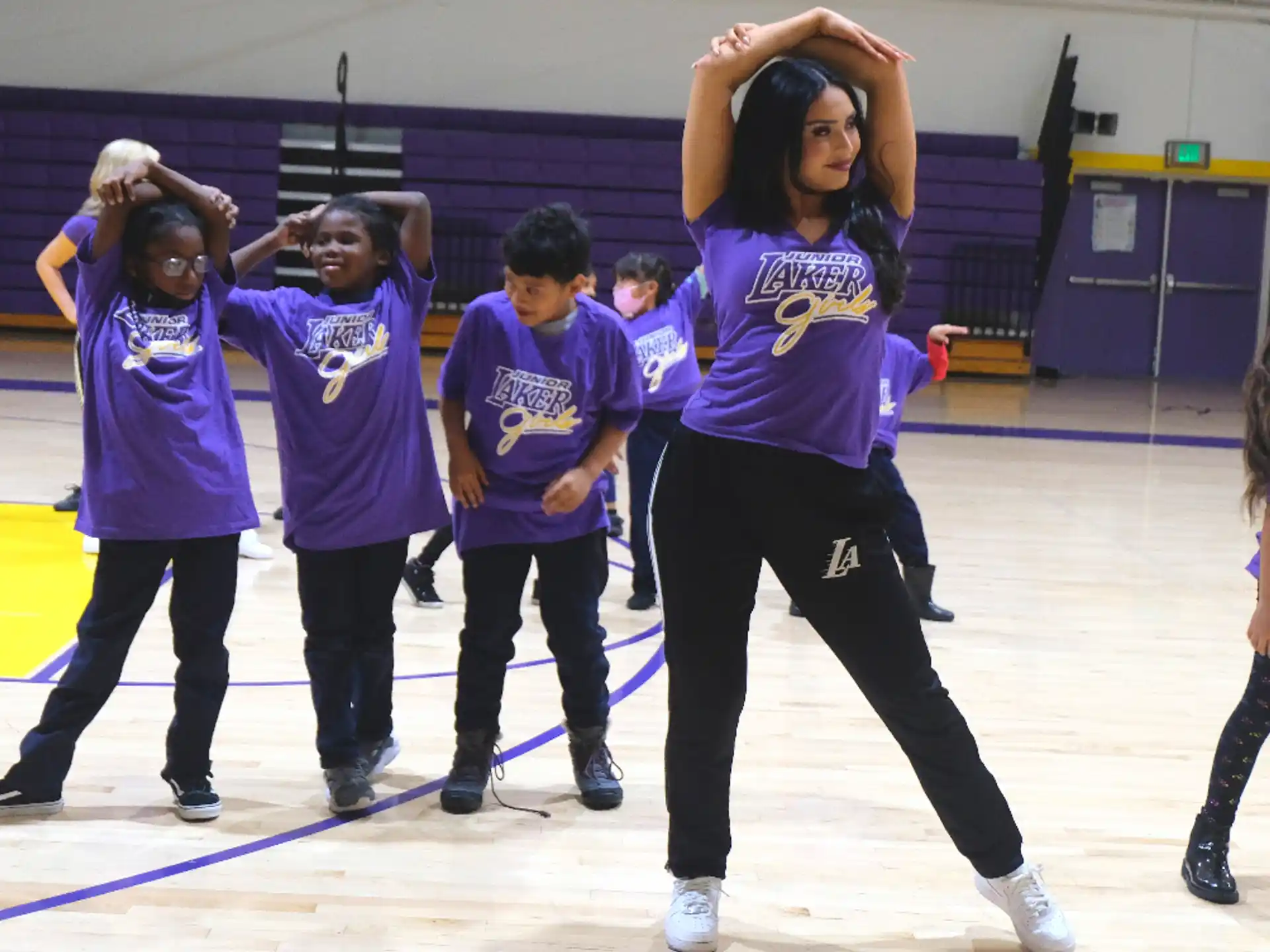 a group of people in purple shirts