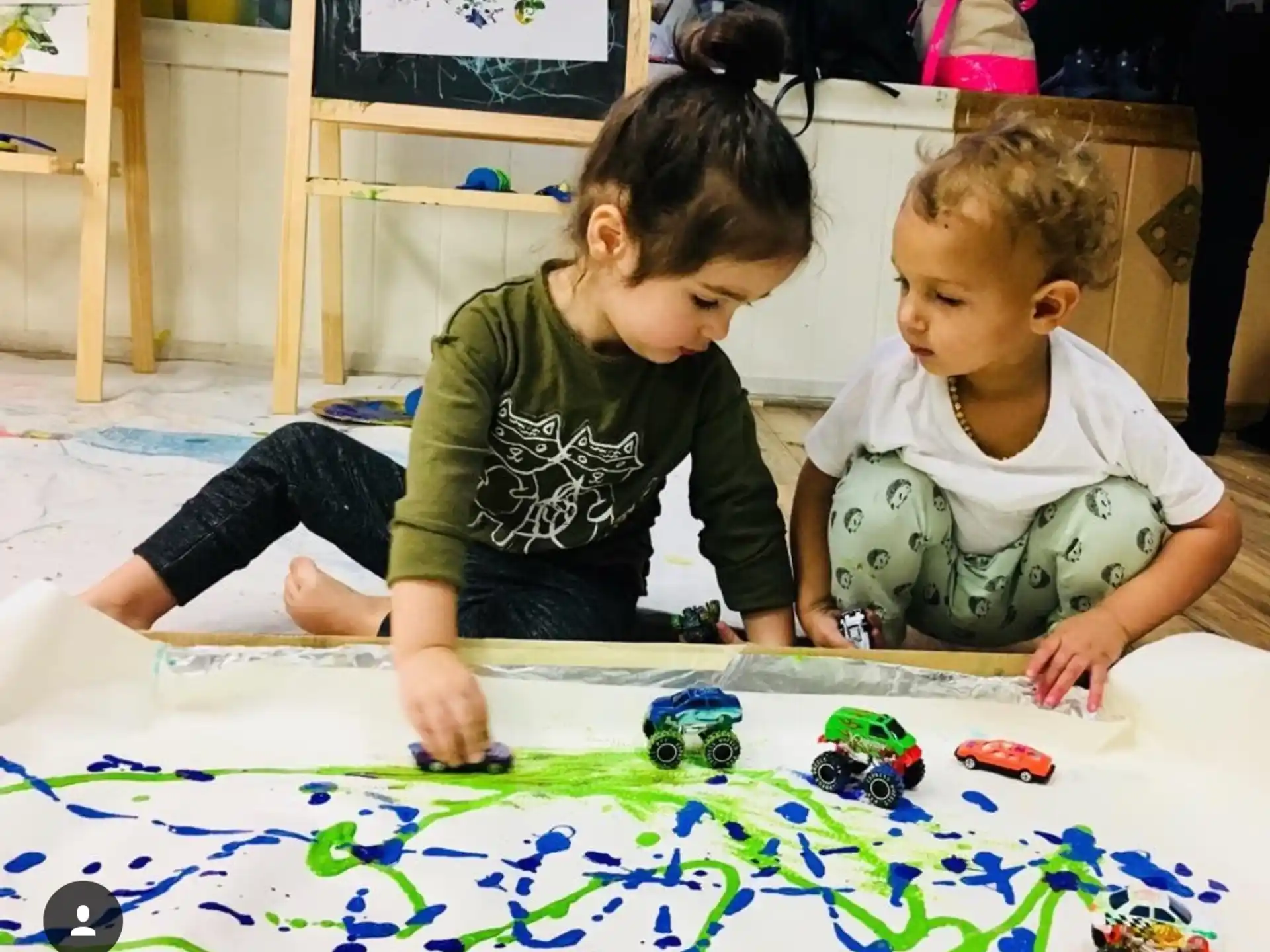 a couple of kids playing with toys