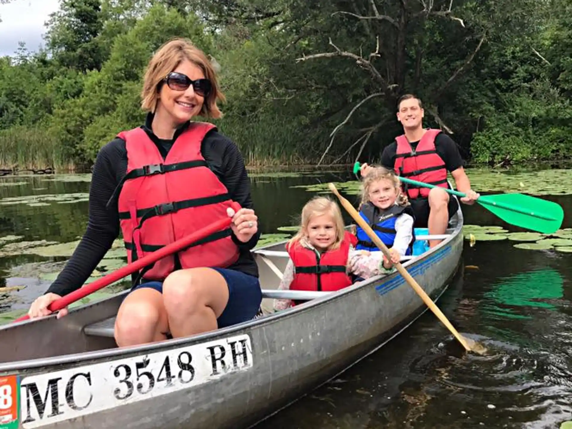 a group of people in a canoe