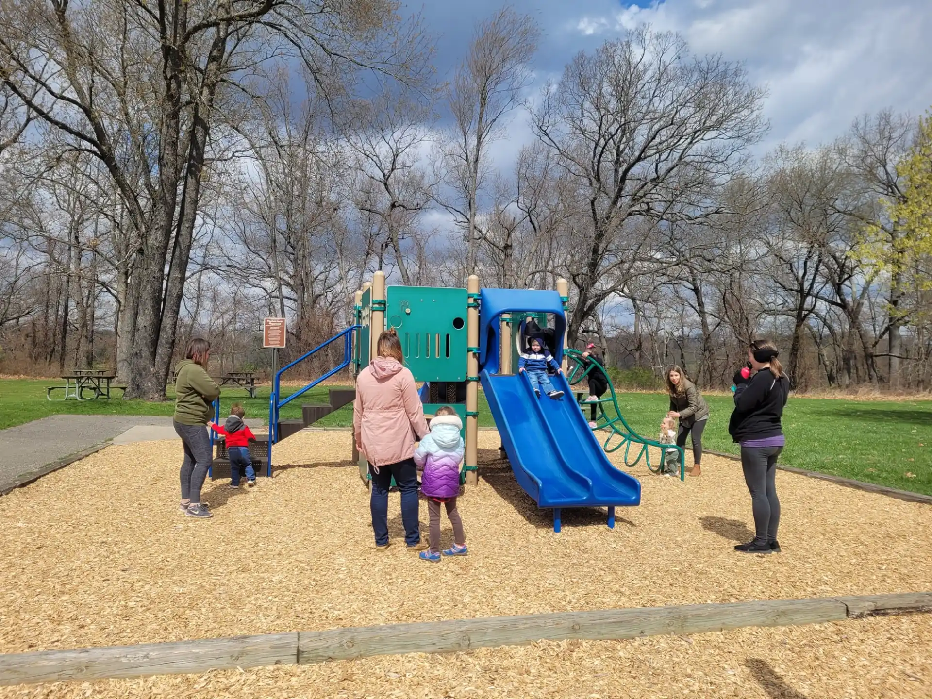 a group of people playing on a playground