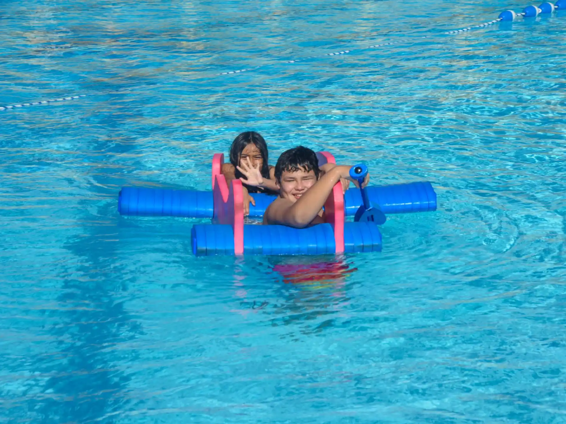 a group of people on a floaty in the water